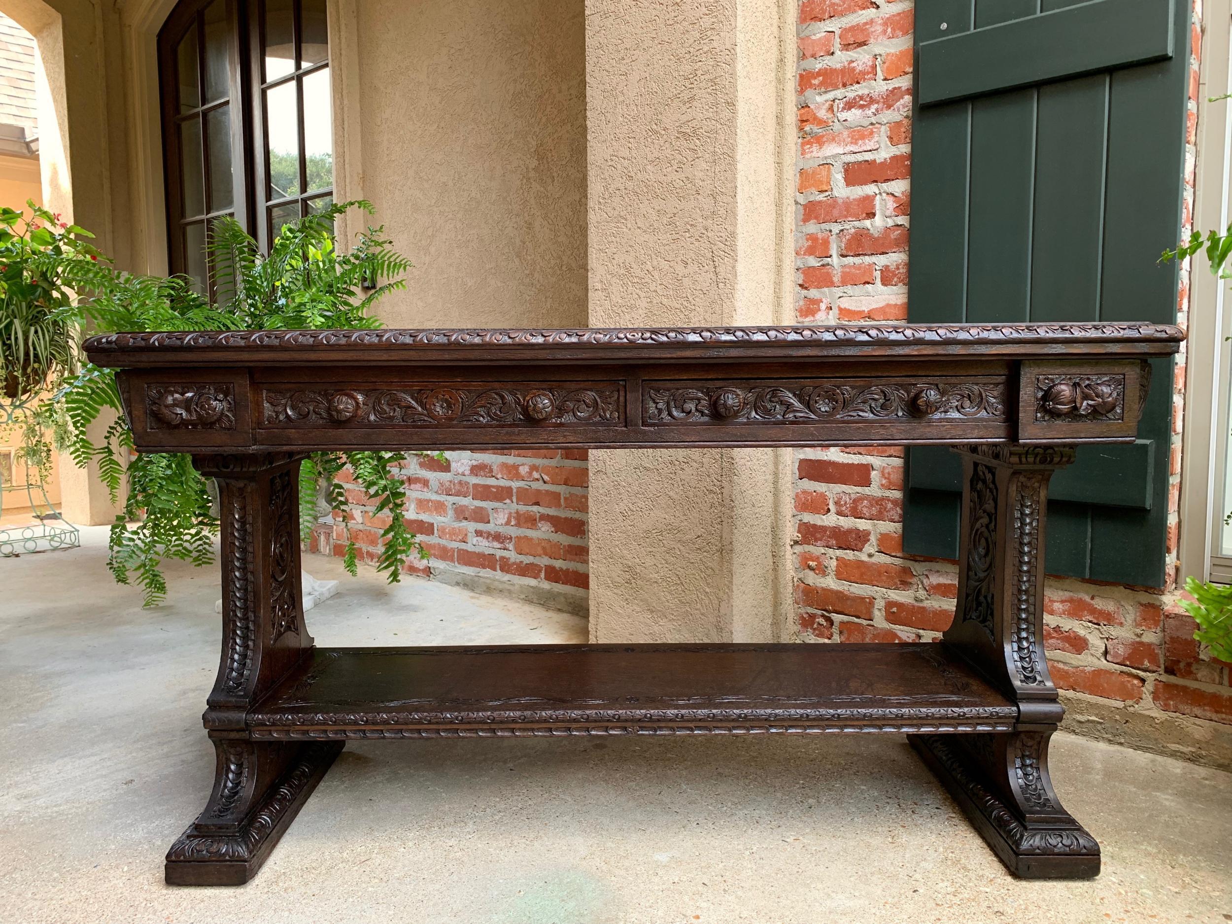 Antique French carved dark oak sofa table foyer console trestle black forest 19c

~Direct from France~
~Superb 19th century French carved sofa table with a stunning silhouette and a large, almost 5 ft. length!~
~Hand carved band to the top, with
