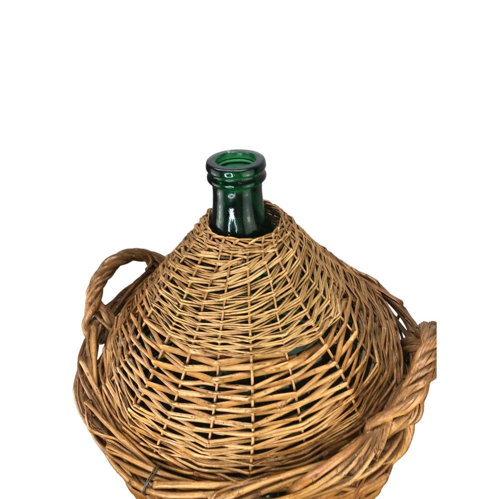 Large French Demijohn in Woven Wicker Basket with carrying handles. The wicker helped protect the glass bottle from temperature changes. In very good condition with minor wicker losses. Bottle is separate from the wicker and can be displayed