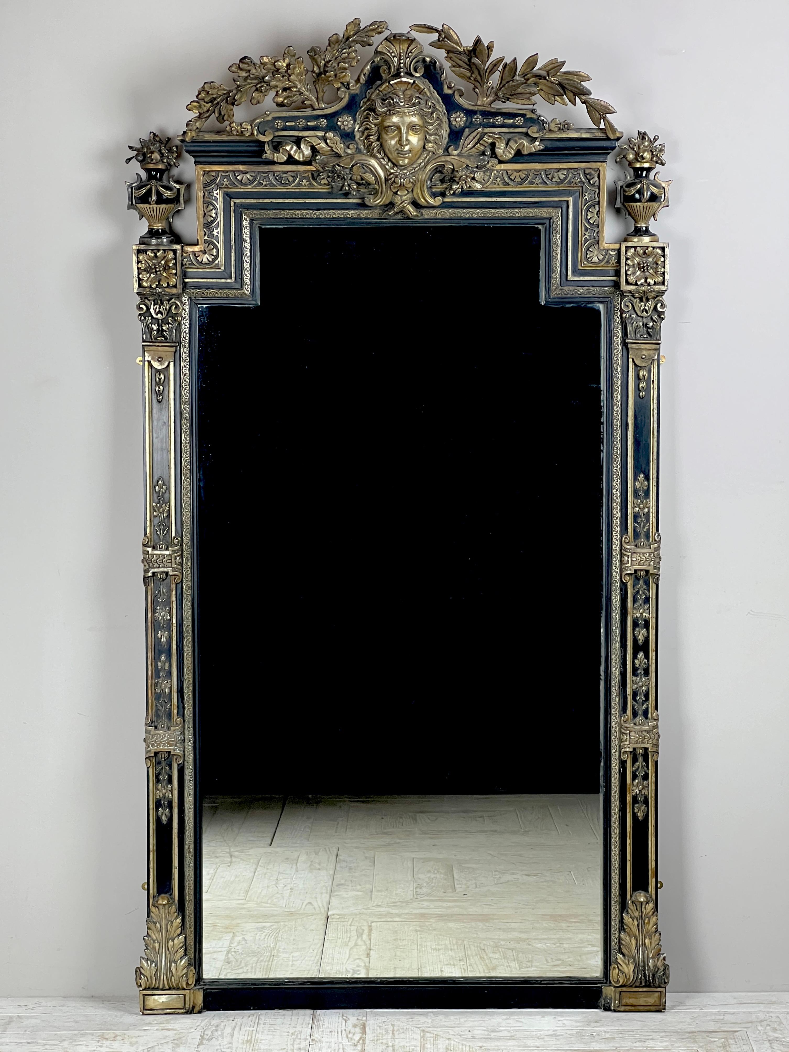 A Stunning Antique French Ebonized & Silver Gilt Floor or Overmantel Mirror, Circa 1892

This striking and grand antique French mirror, dating to around 1892, exudes elegance with its imposing presence. The beautifully crafted, ebonised frame is