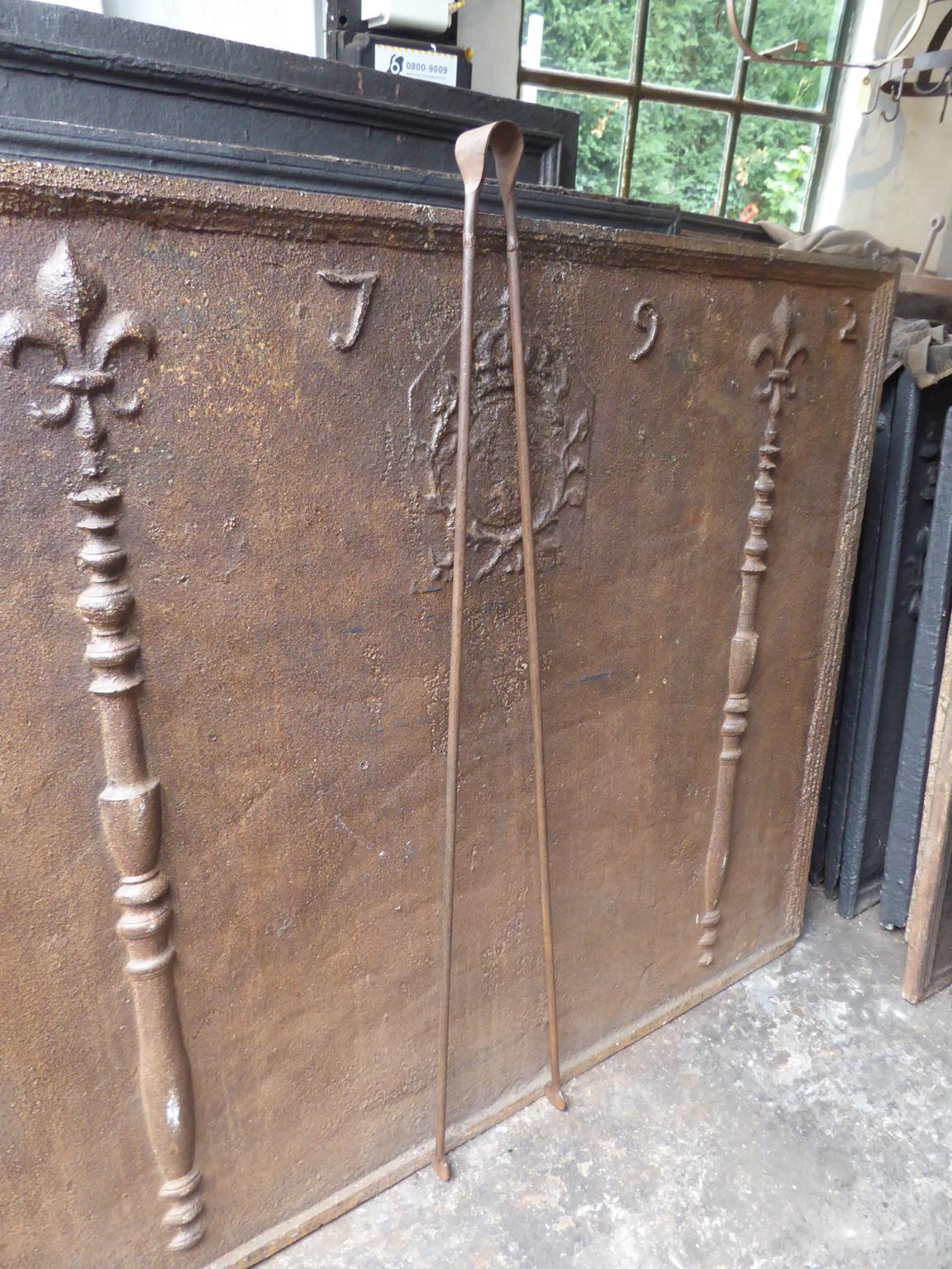 Large 19th century French Napoleon III fireplace tongs made of wrought iron.