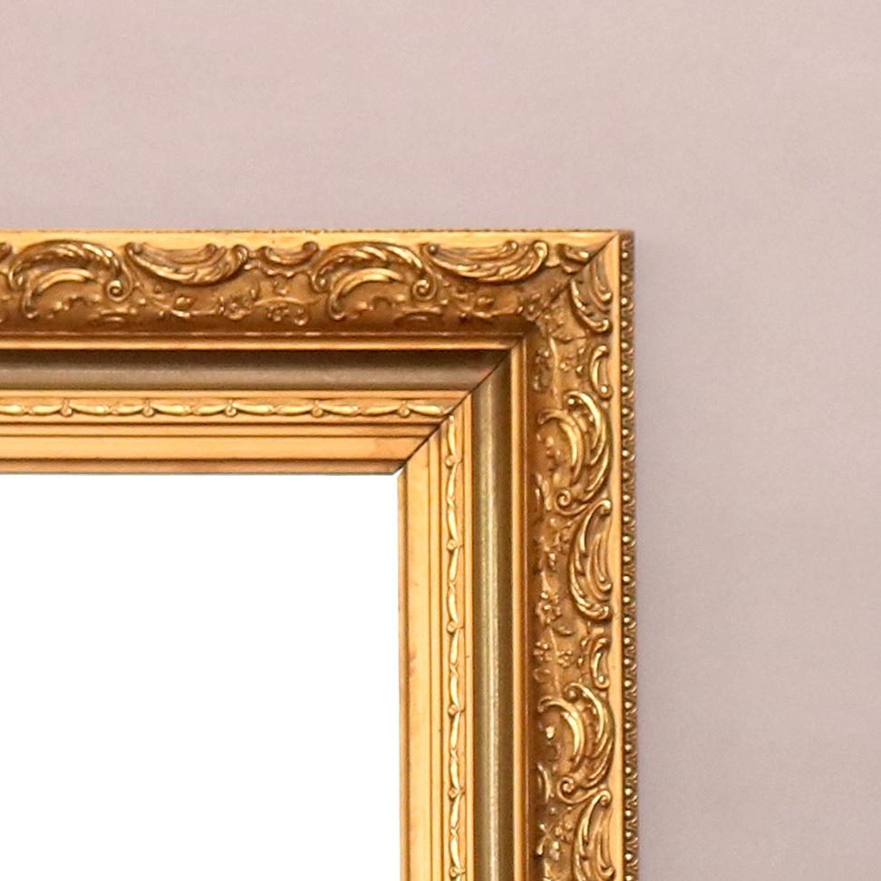 A large and antique French wall mirror features foliate and scroll decorated giltwood frame, c1920

Measures - 37.25