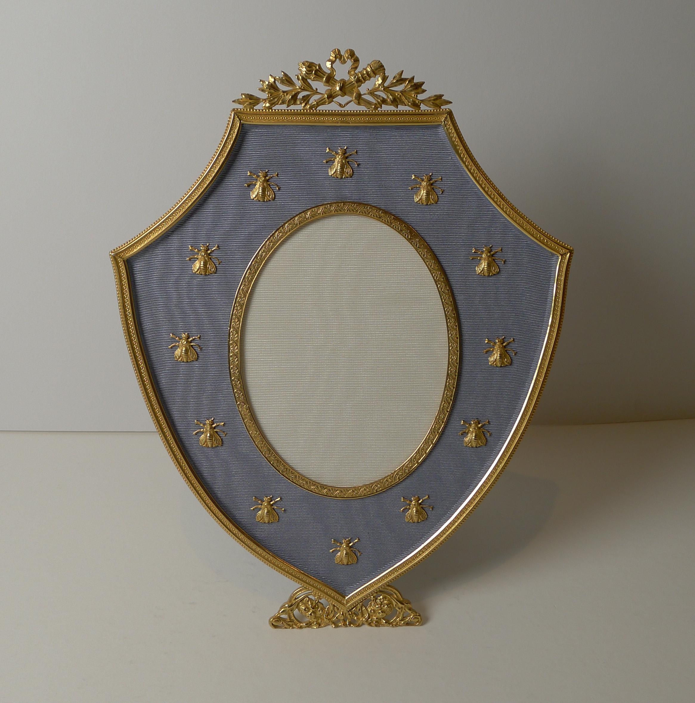 A stunning shaped picture frame made from bronze and smothered in gold, beautifully cleaned and restored to it's former glory dating to c.1900.

These frames with gilded bronze Napoleonic bees are always highly sought-after and particularly hard