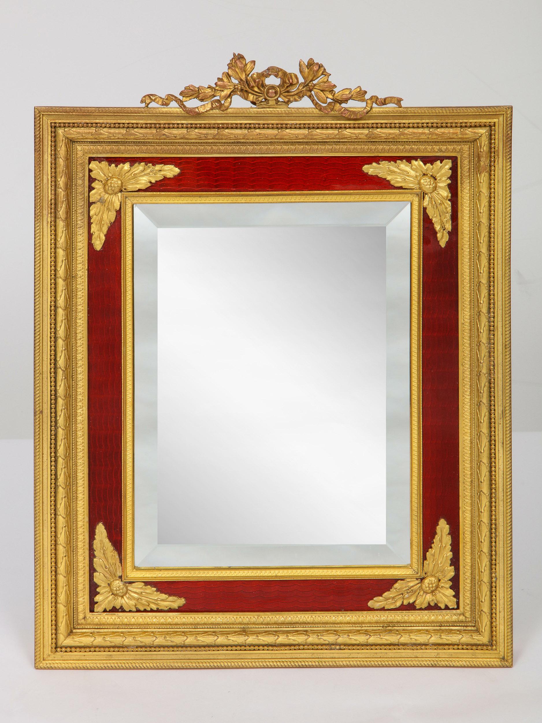 A beautiful, large and elegant French gilt bronze ormolu and red guilloche enamel antique table mirror frame, circa 1895.

Very fine quality.

Measures: 15.5
