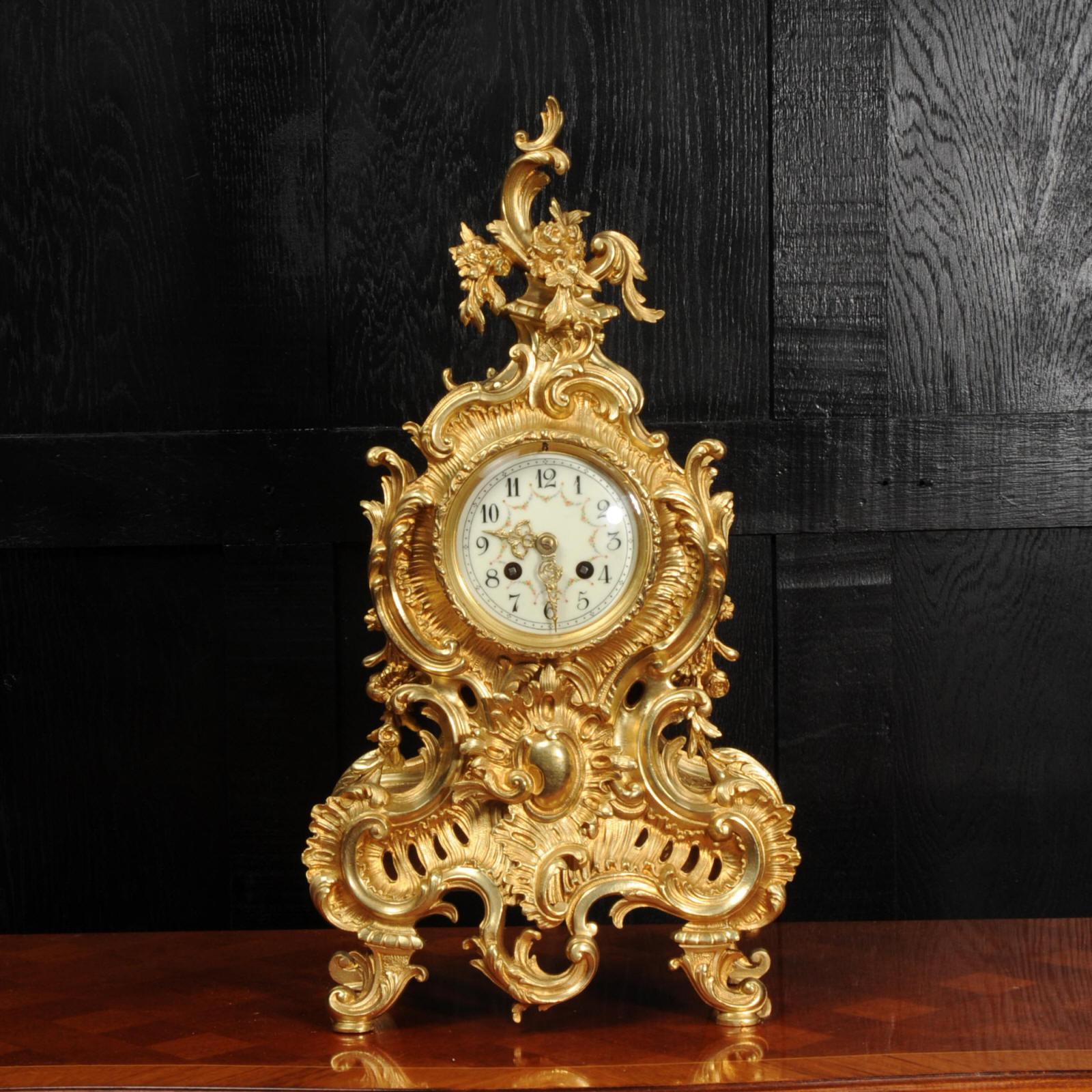 A large, superb and very decorative original antique French clock by the famous maker Japy Frères, circa 1880. It is boldly modelled in the Rococo style in finely gilded bronze. Asymmetric waisted case, decorated profusely with acanthus leaves and