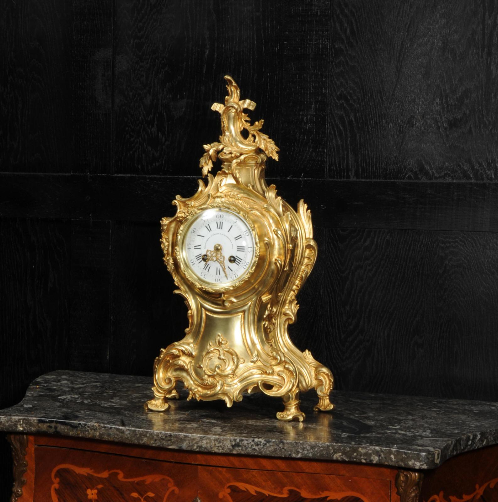 A large and stunning original antique French clock by Louis Japy and retailed by Maison Henri Riondet of Paris. Boldly modelled waisted balloon shaped case, lavished with fine, asymmetric, scrolls and acanthus. To the top, a Rococo flourish.
The