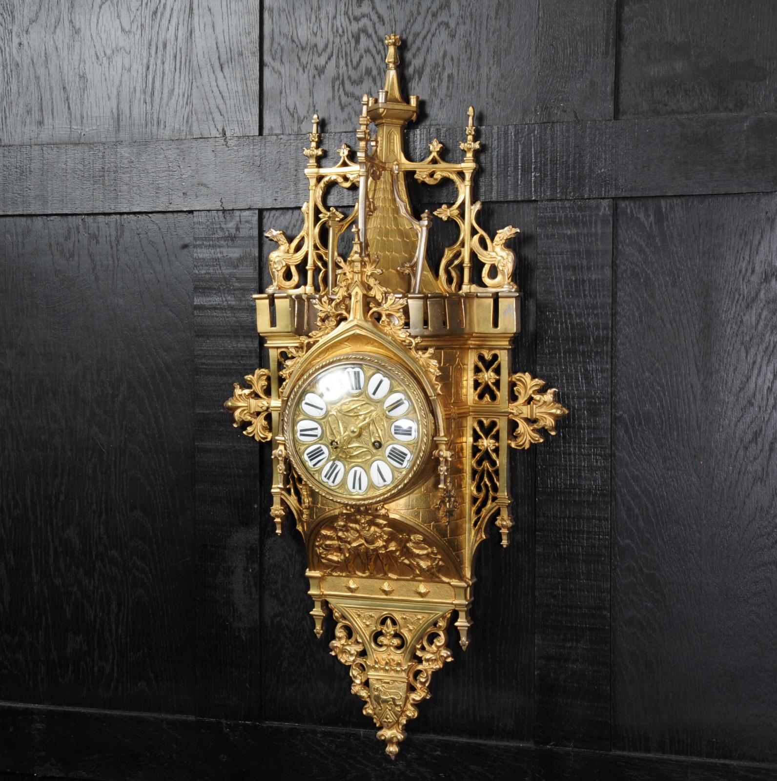 A stunning and rarely available original antique French Gothic wall clock, circa 1880. Modelled in gilded and silvered bronze with beautifully defined Gothic detail; fine tracery, carved leaved, gargoyles, mythical creatures and heraldic motifs. The