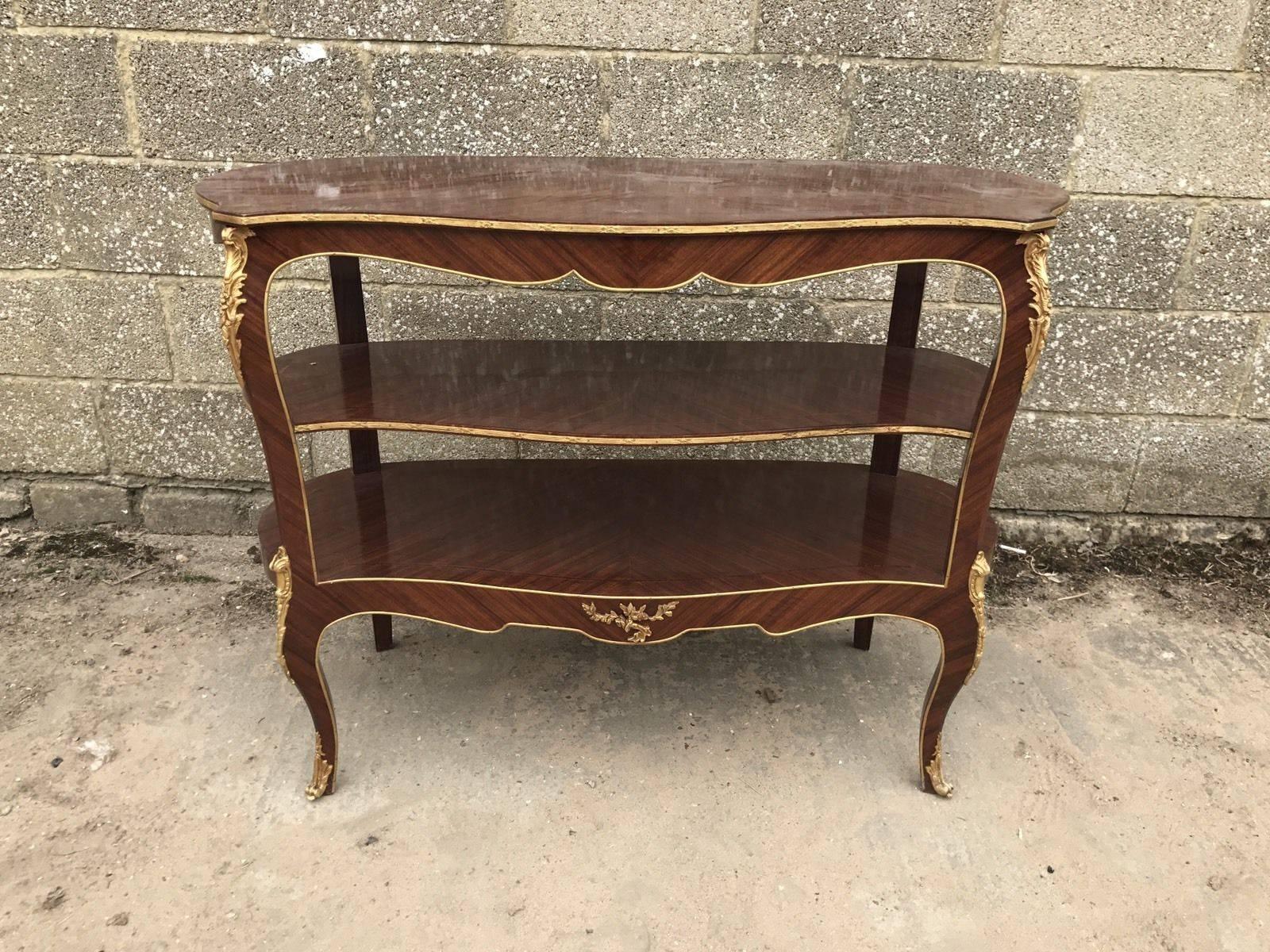 Here we have a lovely French three-tier table on brass castors. Nice shape and condition.

 

Dimensions- 121cm wide, 90cm tall, 50cm deep.

 
See my other ads for more french furniture.