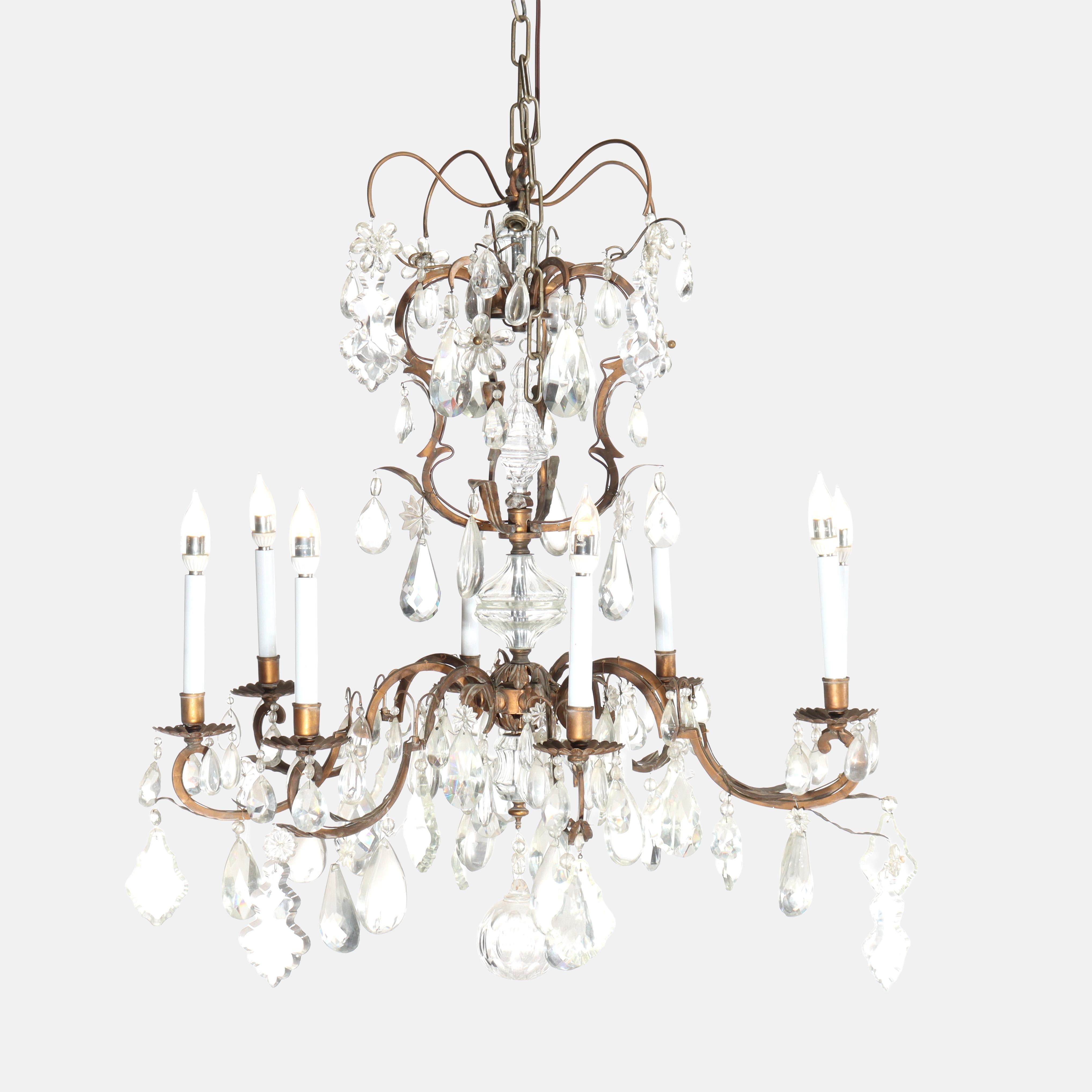 Antigua araña francesa de latón y cristal de 8 luces estilo Luis XIV C1930

Medidas - 43 1/2