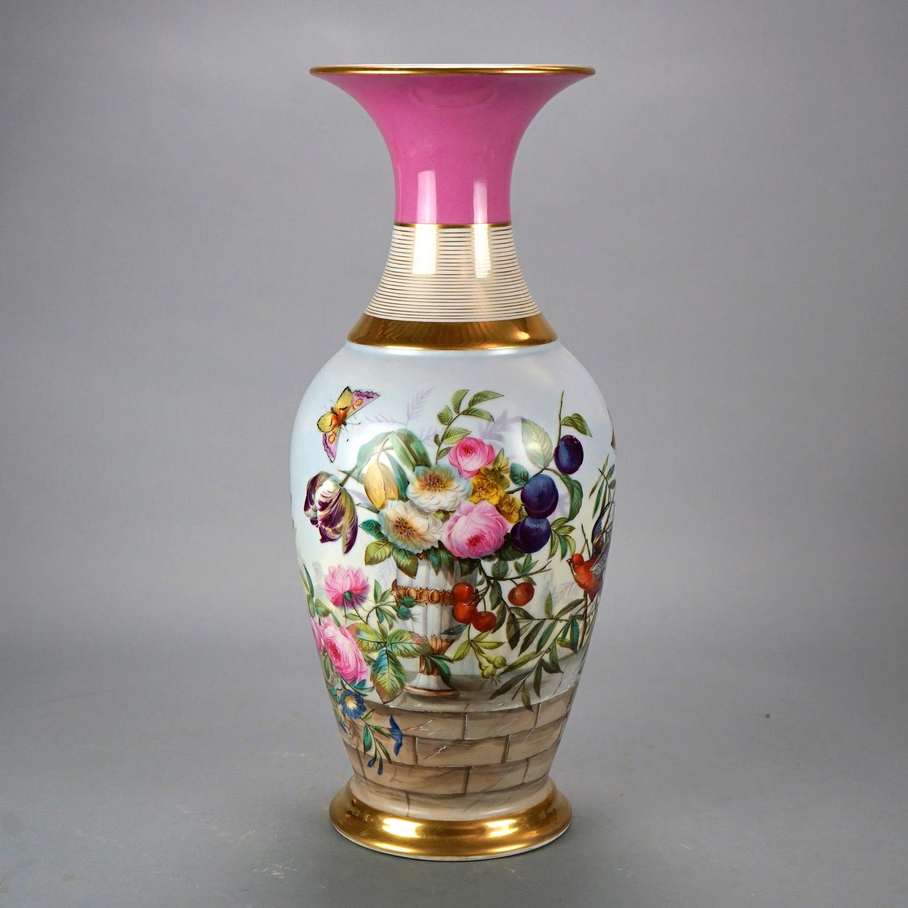 An antique and large French Old Paris vase offers porcelain construction with hand painted garden scene having flowers, butterflies and gilt highlights throughout, 19th century

Measures- 21.5'' H x 8.75'' W x 8.75'' D.