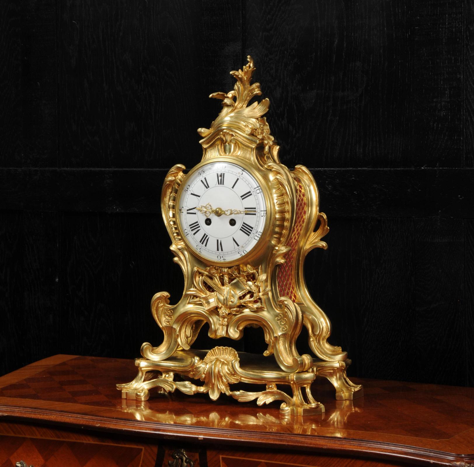 A superb and substantial gilt bronze clock. It is of the highest quality, beautifully modelled and finished in ormolu (finely gilded bronze or doré bronze). It is of balloon shape, formed with bold scrolls, curves and acanthus. Below the dial is a