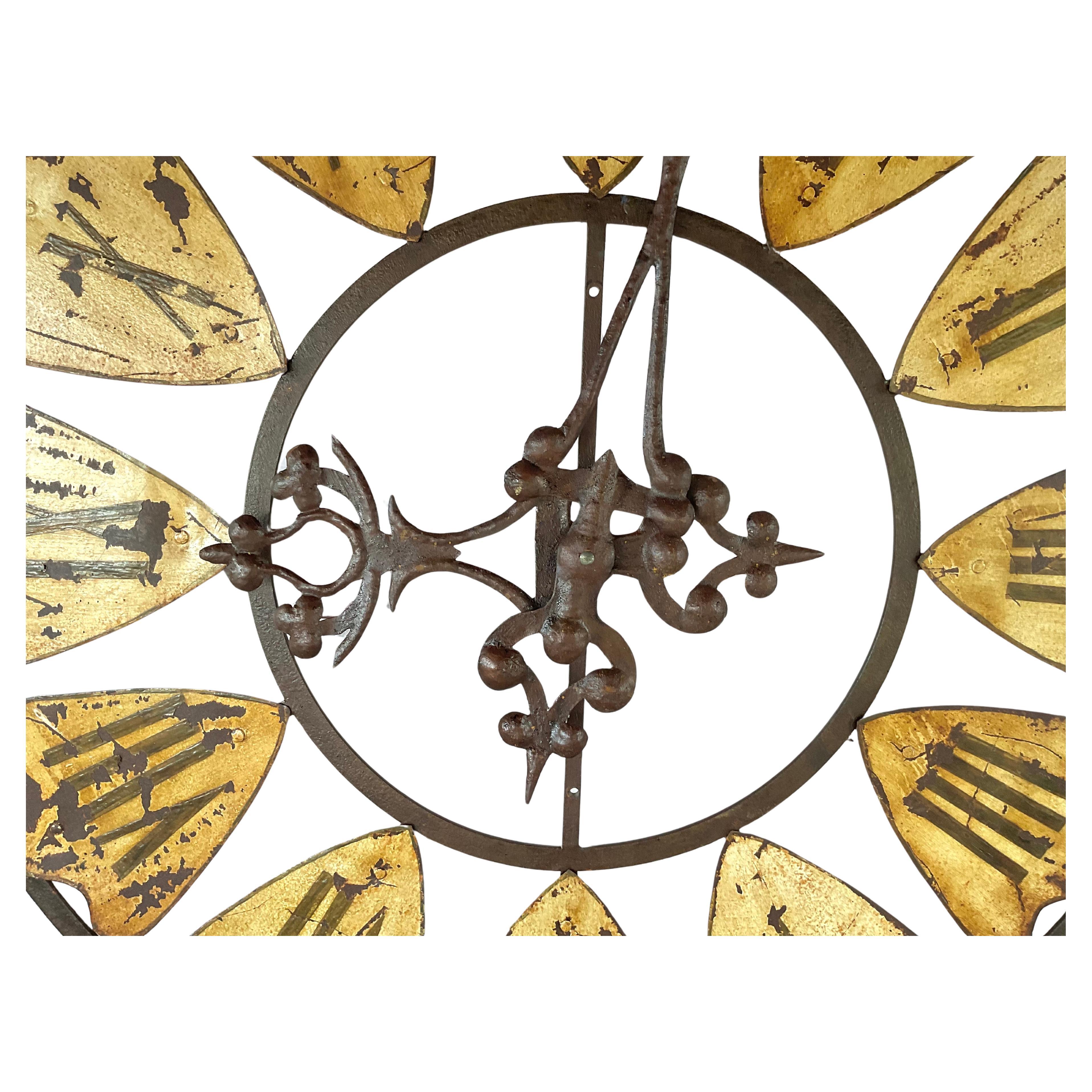 This rare Late 19th Century French Tower Clock Face is a sculptural piece that once adorned the exterior of a public or municipal building in France. Piece is crafted from hand-wrought iron and patinated tin. The clock's oversized presence and