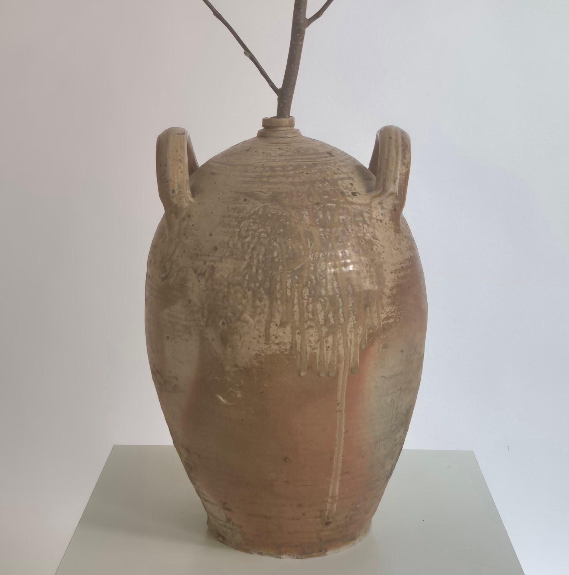 Ceramic urn with nice antique patina due to age and use. France mid1900s. 

Signs of age, use and a few dents. Perfect for large branches and flowers. No cracks, holds water when tested. 