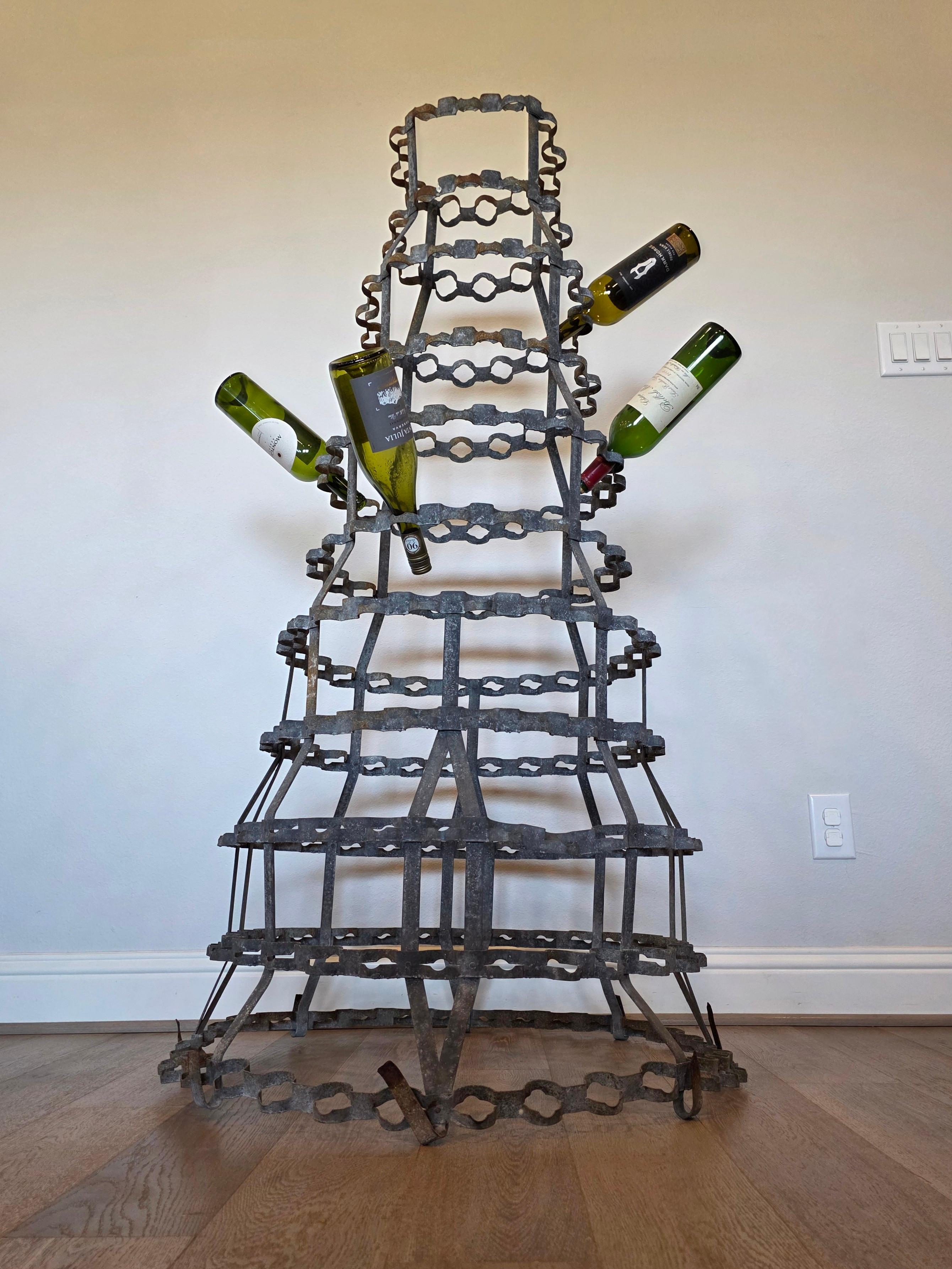 A scarce monumental French industrial bottle drying rack! What makes this example so rare and desirable is that unlike typical drying tree's that can only hold empty bottles, this one can hold unopened bottles! 232 corked bottles to be exact! 

Late