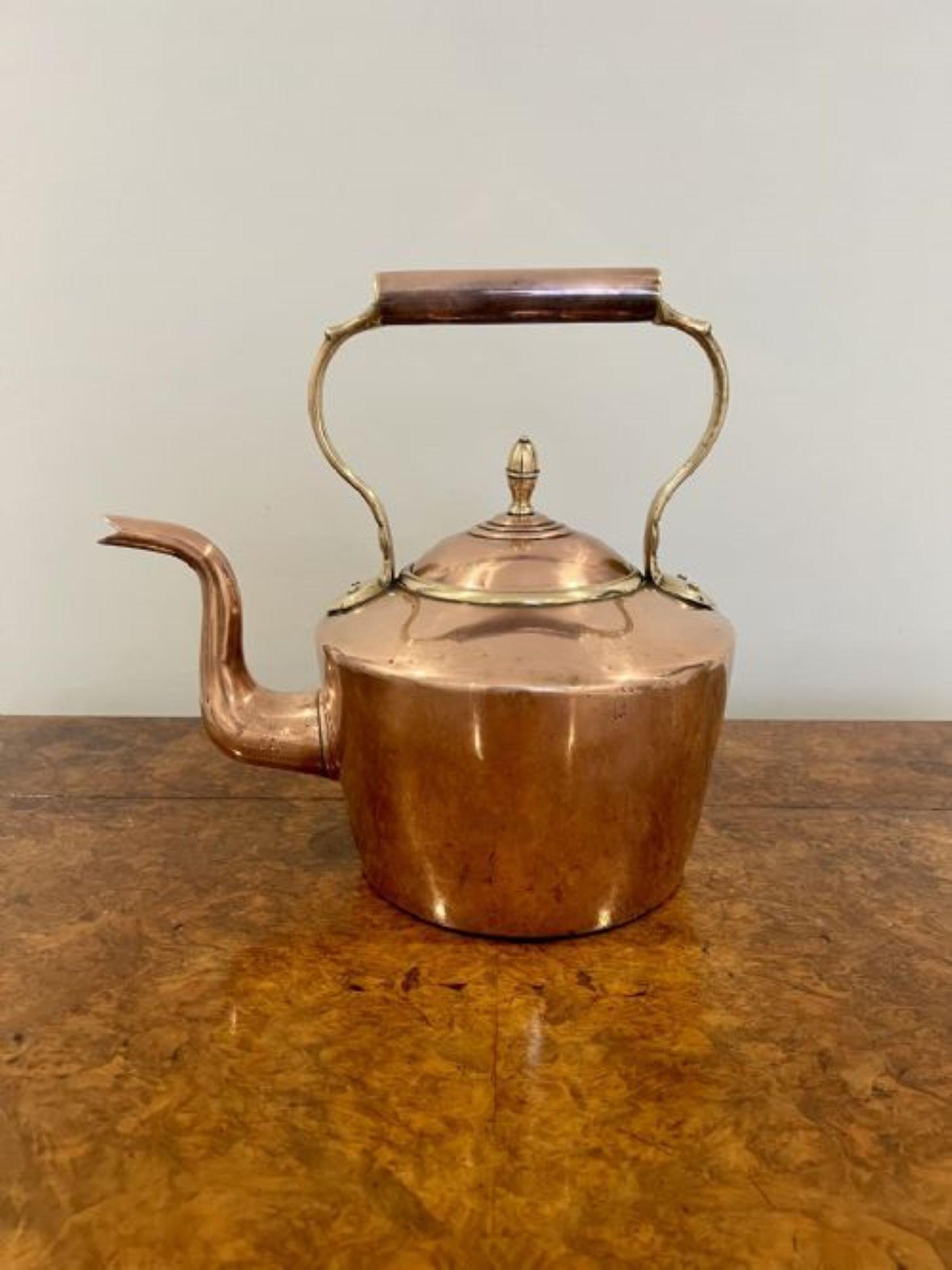 Large antique George III copper kettle having a shaped handle and spout, lift off lid with the original original brass knob.