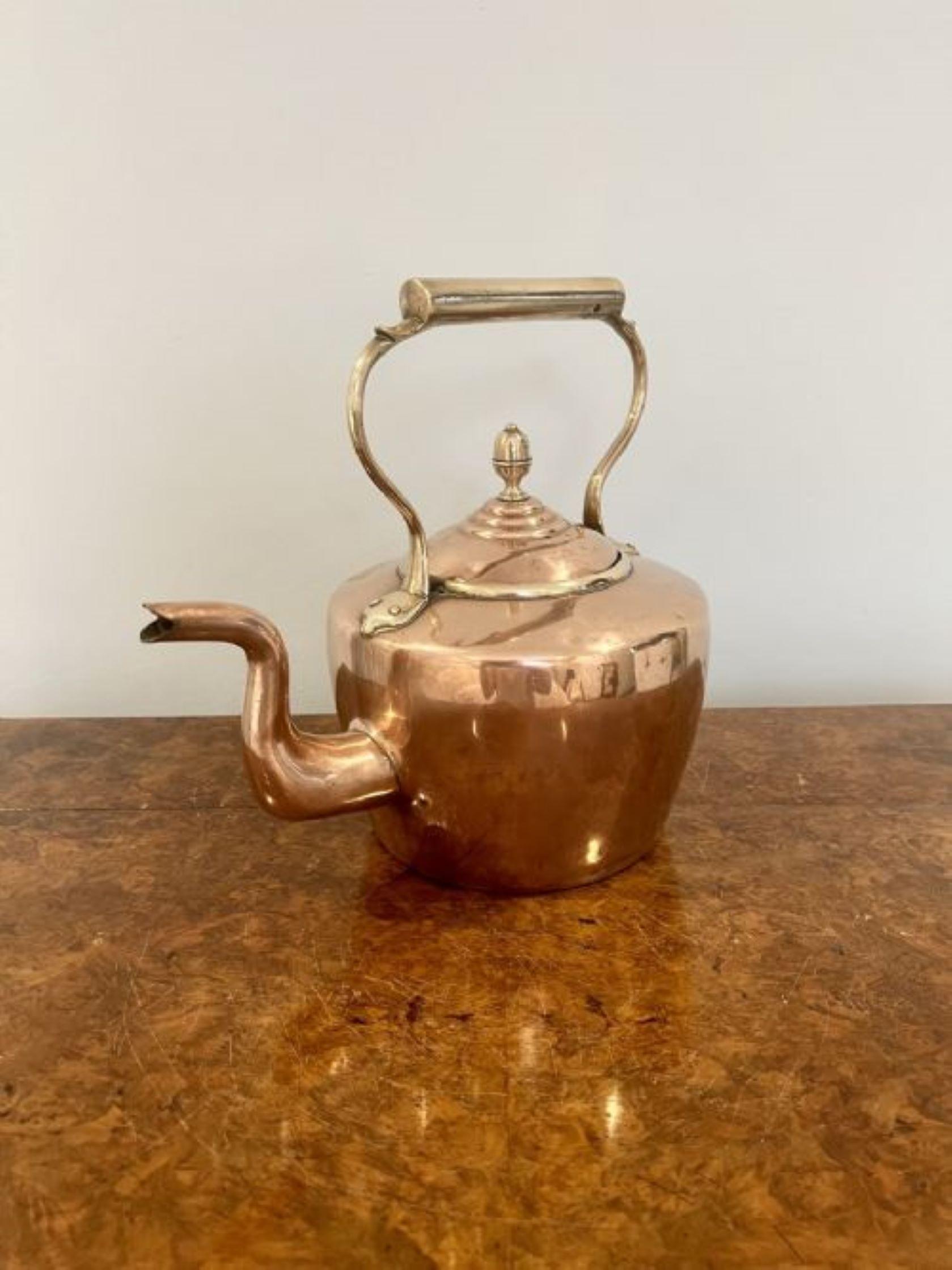 Large antique George III copper kettle having a shaped handle and spout, lift off lid with the original original brass knob.
