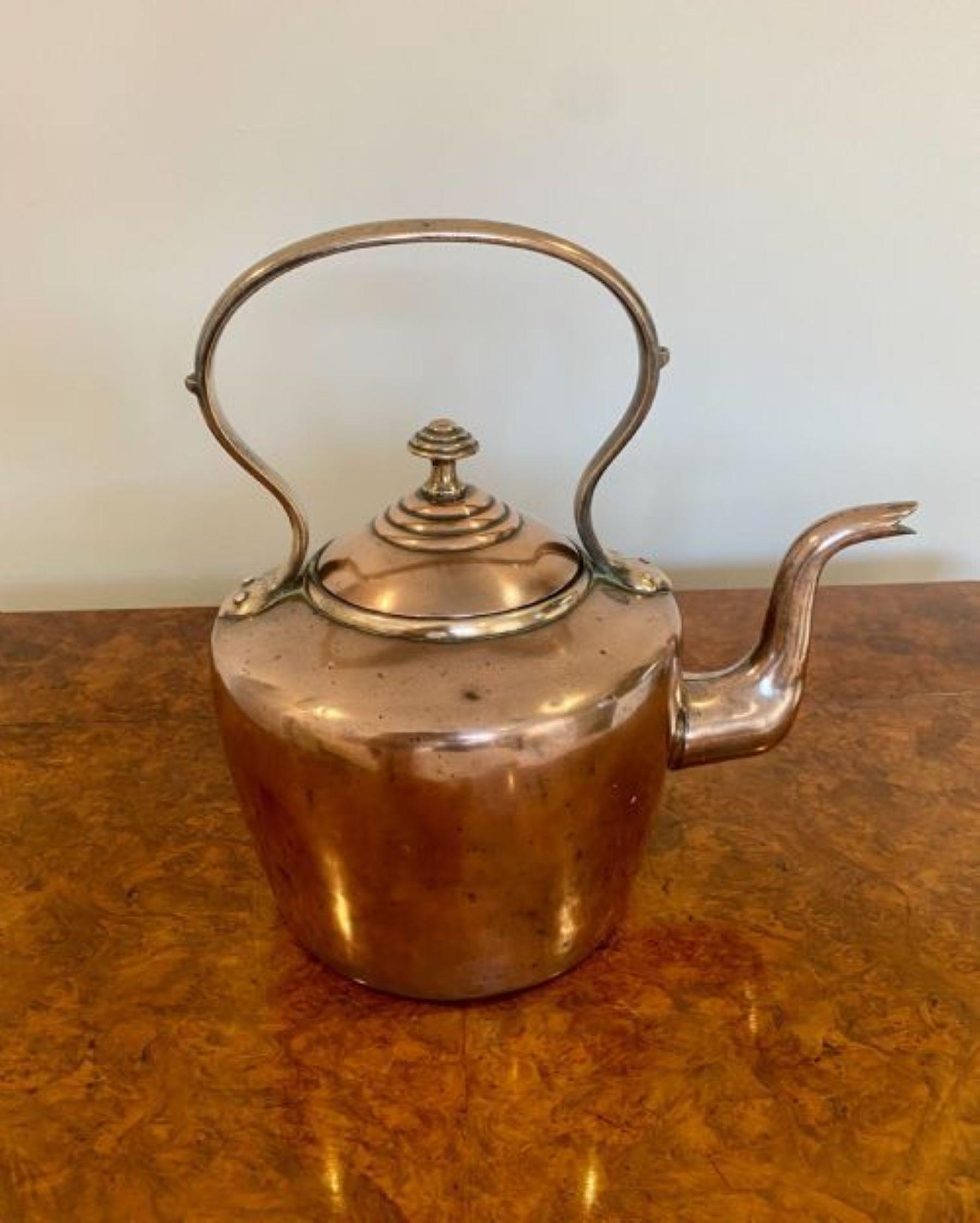 Large antique George III copper kettle having a shaped handle and spout, lift off lid with original knob.