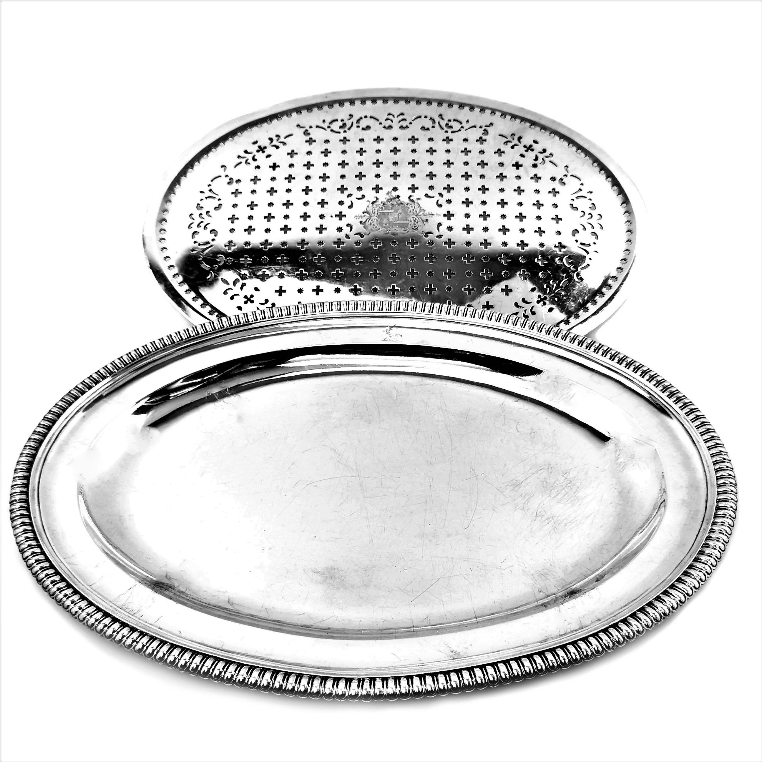 A magnificent antique Georgian sterling Silver Oval Meat Platter with a classic gadroon edge border. The Platter has a fitted oval Mazarine with a decorative pierced pattern to allowed the meat juices to drain into the platter below. The Platter can
