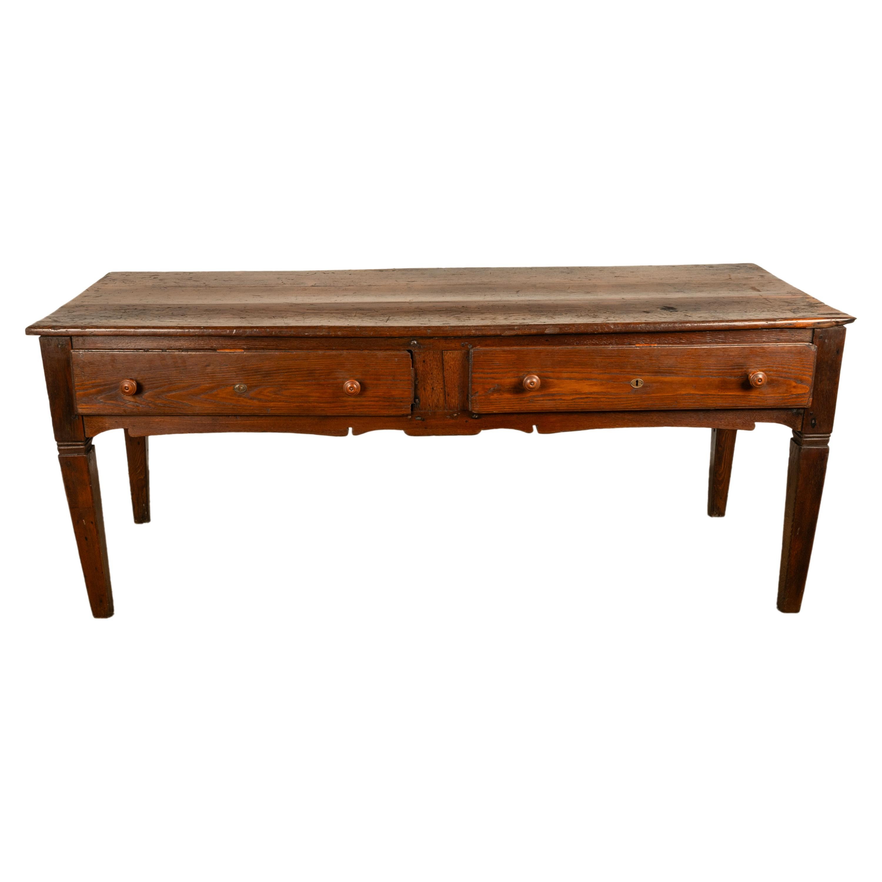 A very good antique Georgian country house elm scullery or kitchen preparation or serving table, circa 1820.
This long three plank top prep or serving table came from a large 18th century country house in North Yorkshire England. The table is made