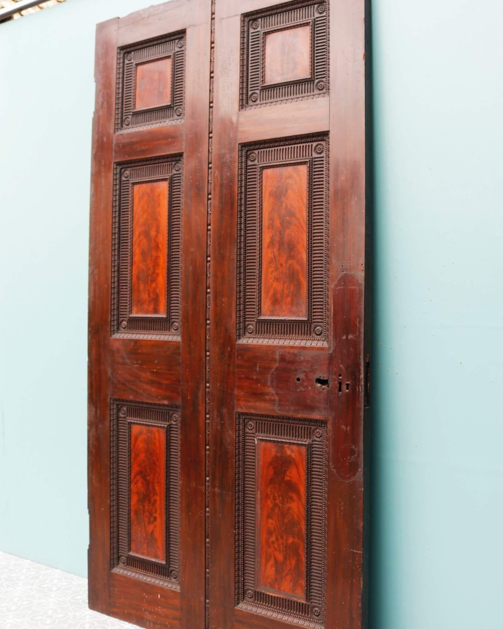 A very large Georgian mahogany door, sourced from an English country house. At over 200 years old, this impressive door has certainly stood the test of time. It incorporates a range of styles, including Georgian, Regency, and Neoclassical style,