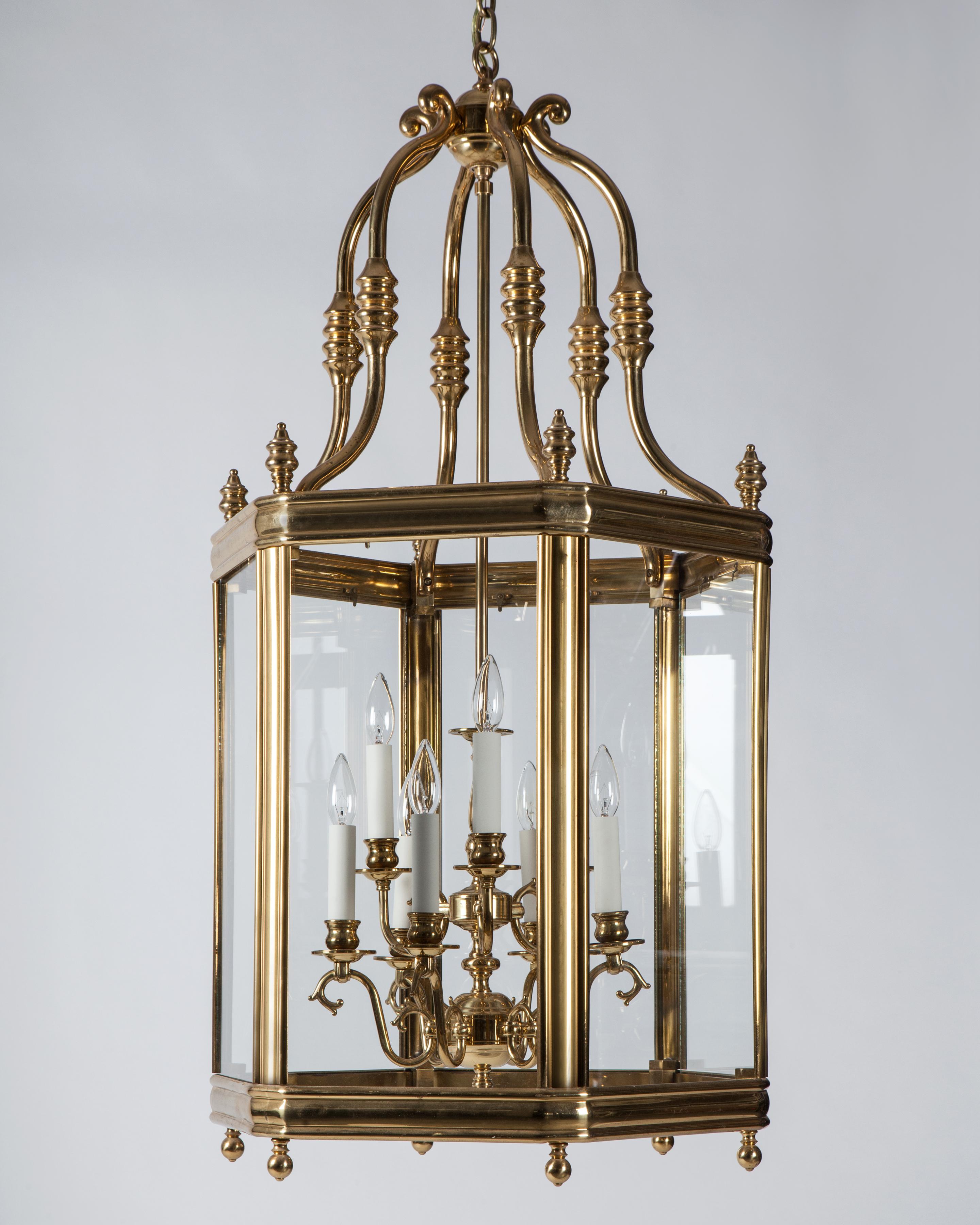 AHL4109

A vintage hexagonal lantern with a nine-light central cluster, all in its original polished brass finish. Glazed with clear glass panels. Due to the antique nature of this fixture, there may be some nicks or imperfections in the
