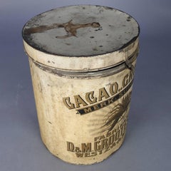 Grande boîte de conserve publicitaire allemande ancienne décorée de chocolat et de groseilles de cacao