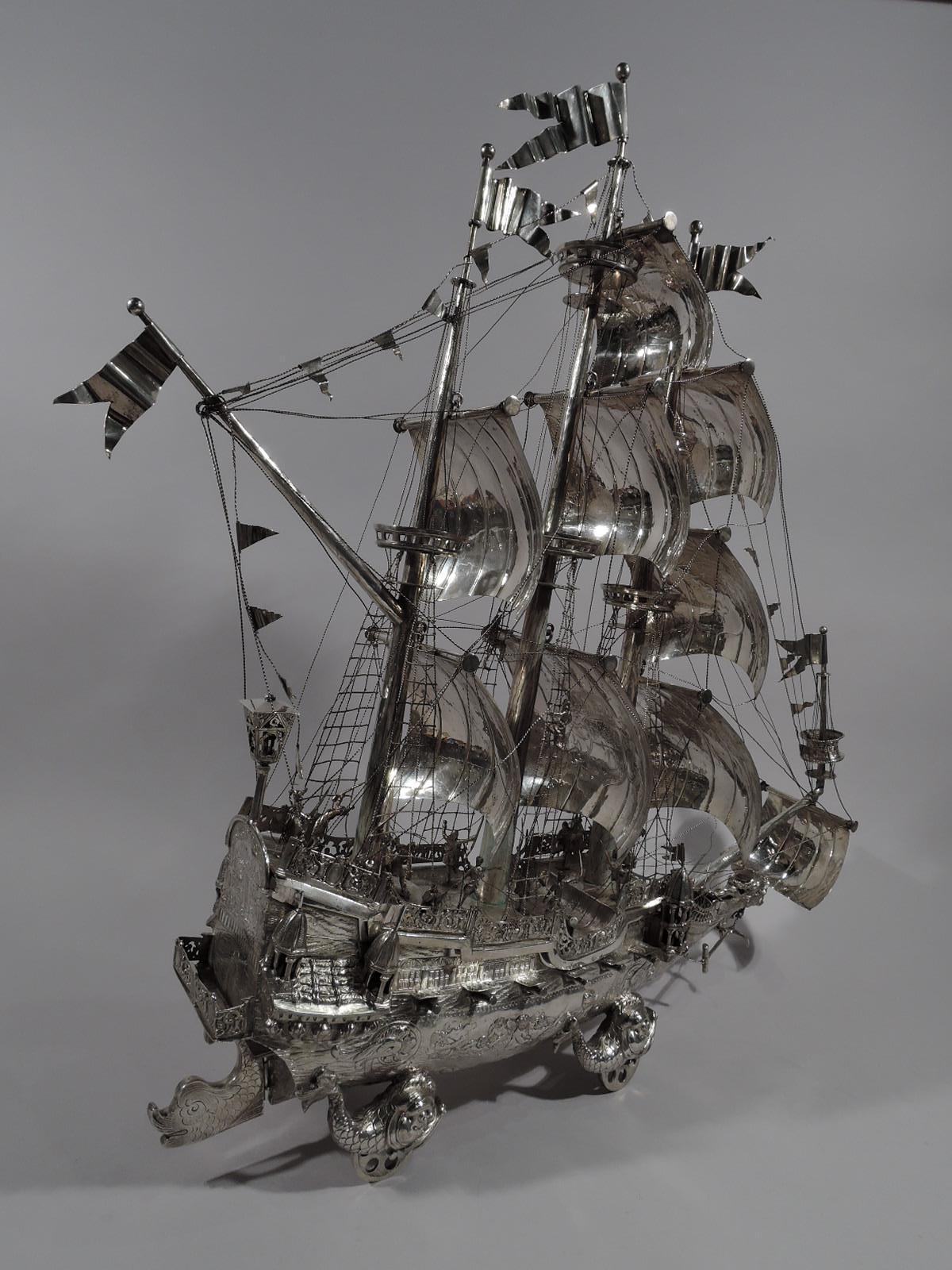 German 800 silver wine trolly nef, circa 1920. A 3-mast galleon with billowing sales and complicated rigging. Gun ports open and cannons ready to fire. Lots of deck action, too with fighting swordsman and fallen sailors. Holds a special cargo