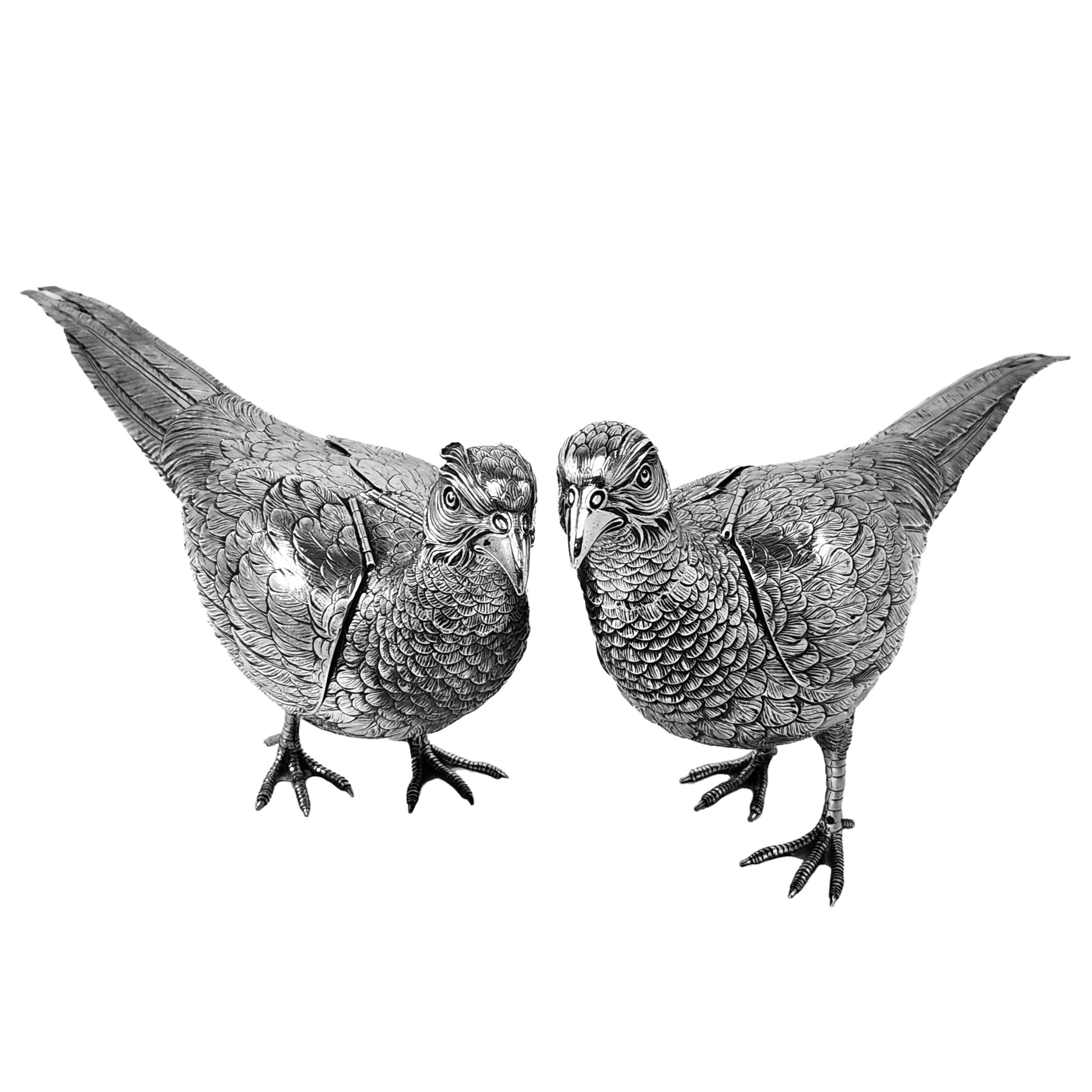 A magnificent pair of Antique Continental Silver Pheasants of notably large size. The pair of Silver Pheasants comprises of a Cock Pheasant and Hen Pheasant. Each Antique Silver Bird is created with a lovely attention to detail and each has hinged