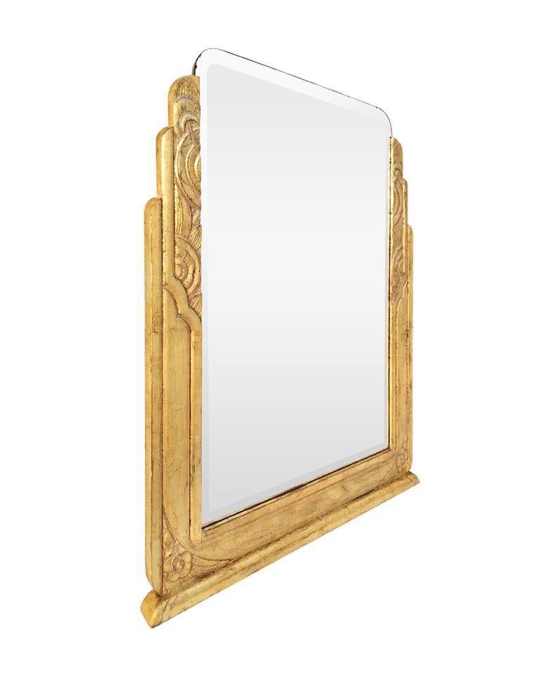 Large antique giltwood mirror, carved wood Art Deco style. Re-gilding to the patinated leaf on carved oak wood (frame width: 10 cm / 3.93 in.). Antique beveled glass mirror. Antique wood back.