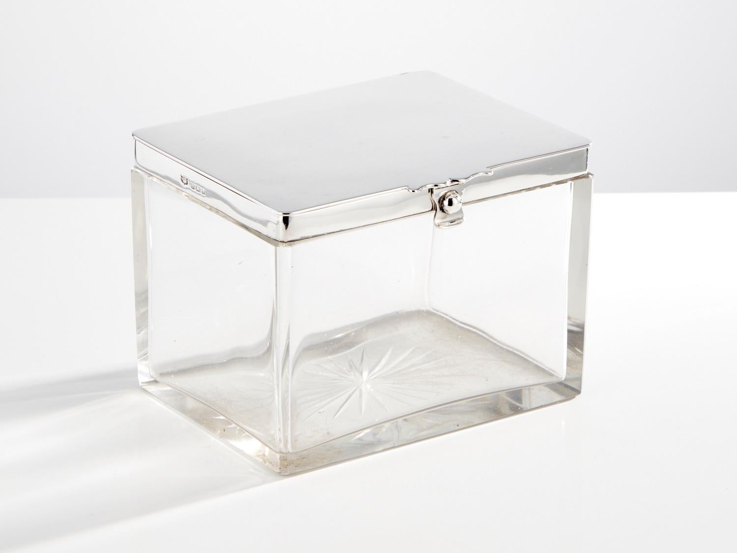 A wonderful large antique glass & silver box by Mappin & Webb Birmingham 1912.

This is a quality piece which would look great as a decorative Barware item or at the table.
The lid is a good gauge silver and with a layer of cork around the lower