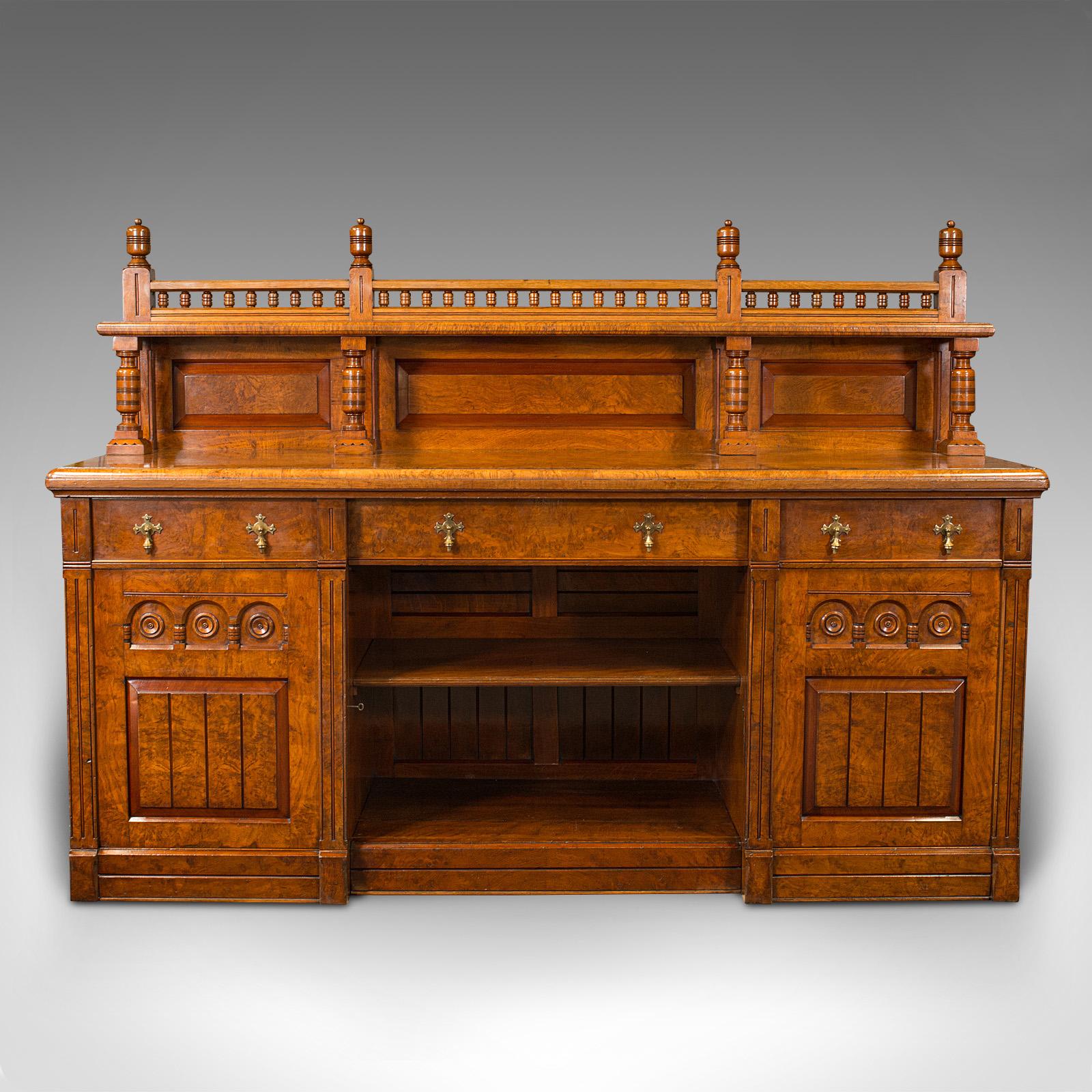 This is a large antique grand sideboard. A Scottish, oak and burr oak buffet cabinet, dating to the mid Victorian period, circa 1860.

Exceptional quality, with craftsmanship and proportion expected of furnishing stately homes.
Displays a