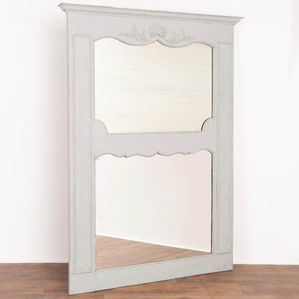 Large French country mirror with molded crown, applied carved flourishes and central divider.
Soft dove gray painted finish accents the graceful curved lines and vertical panel details.
Solid, stable and ready to hang. Any cracks, nicks, scratches