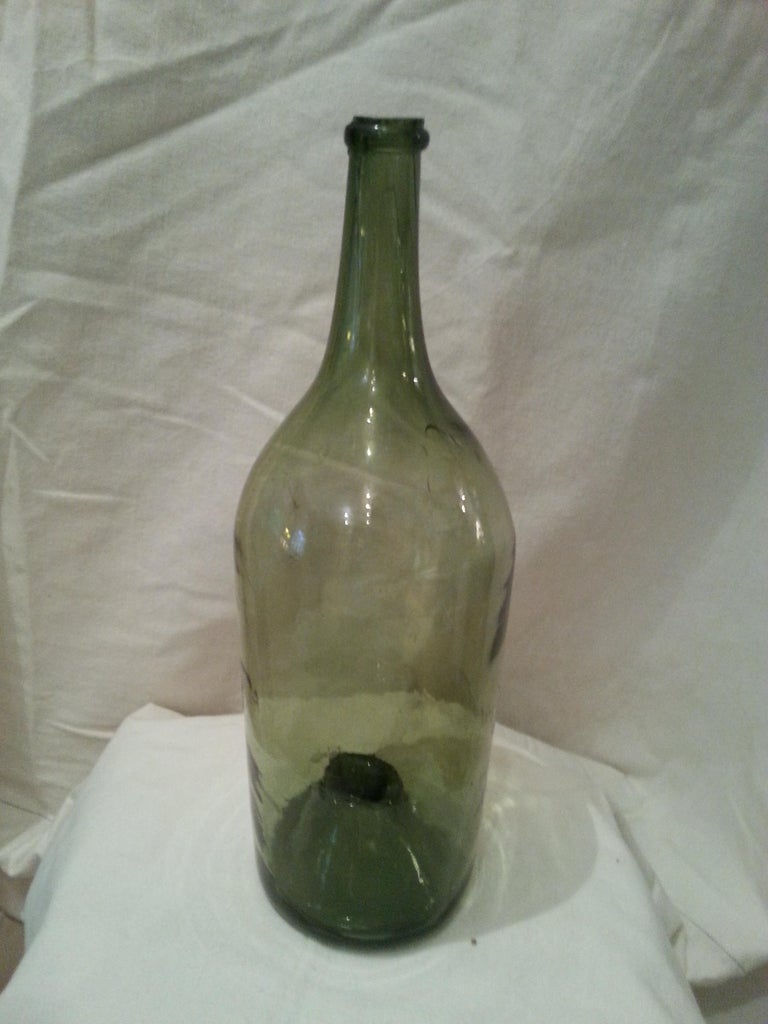 Beautiful antique 1800’s unnamed green glass bottle.

 