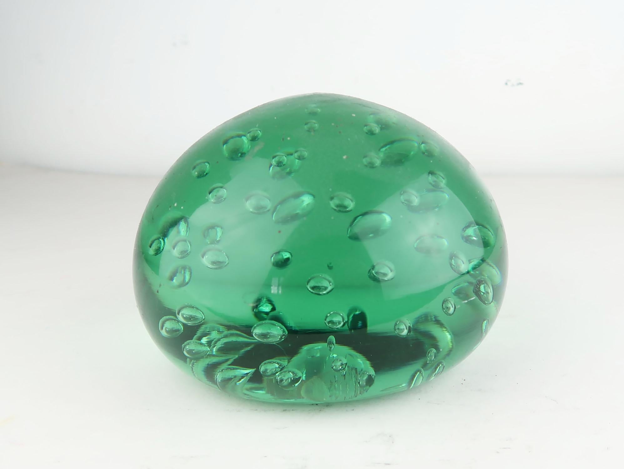 Wonderful piece of green glass with a bubble effect interior.

Most likely originally a doorstop

Good condition.


 