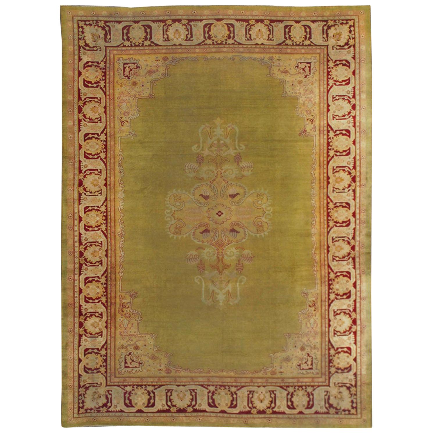 Large Antique Green Indian Amritsar Carpet with Hints of Deep Red For Sale