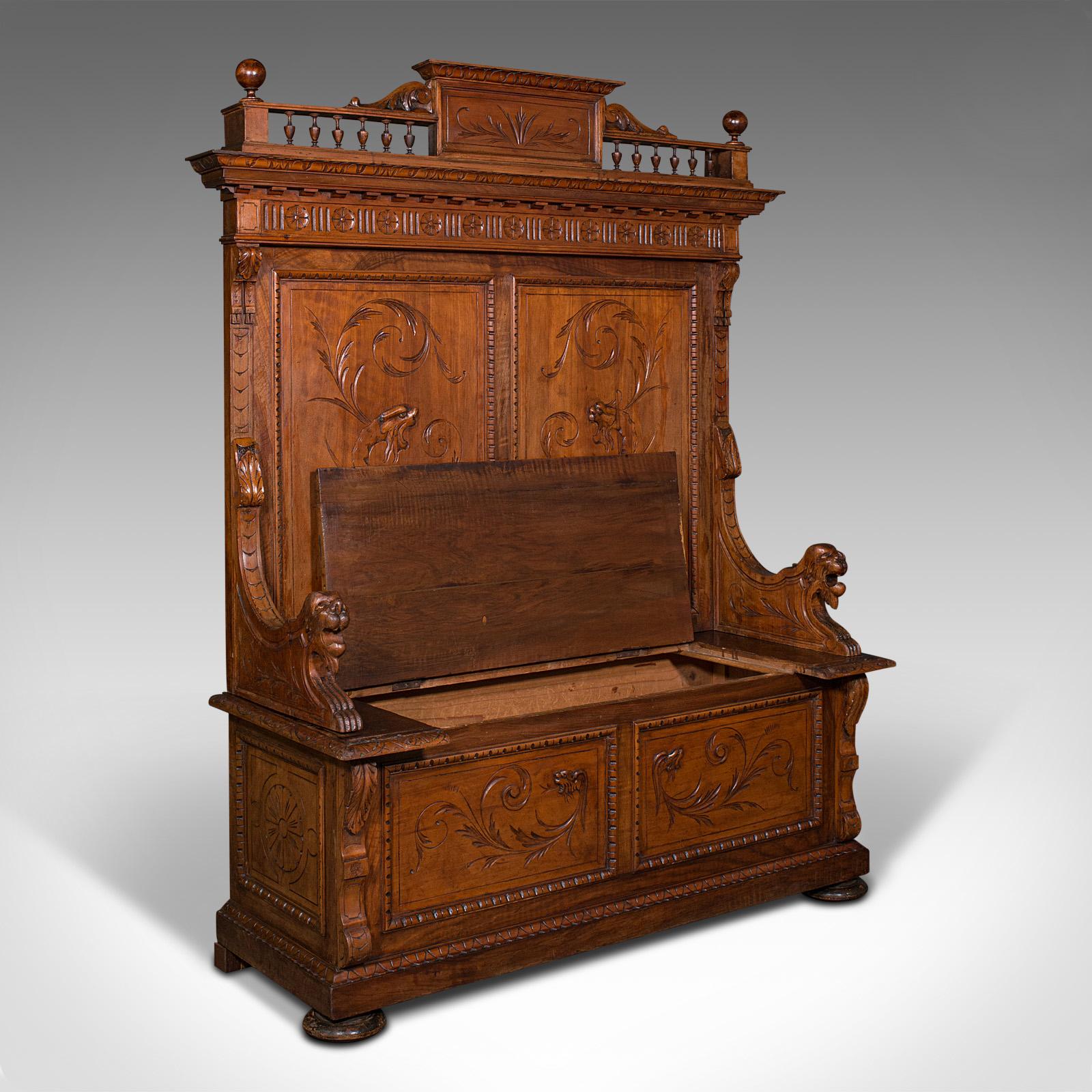 This is a large antique hall settle. An Italian, pine and walnut bench or pew with Oriental taste, dating to the early Victorian period, circa 1850.

Imposing in proportion and carved detail, ideal for the grand reception hall
Displays a