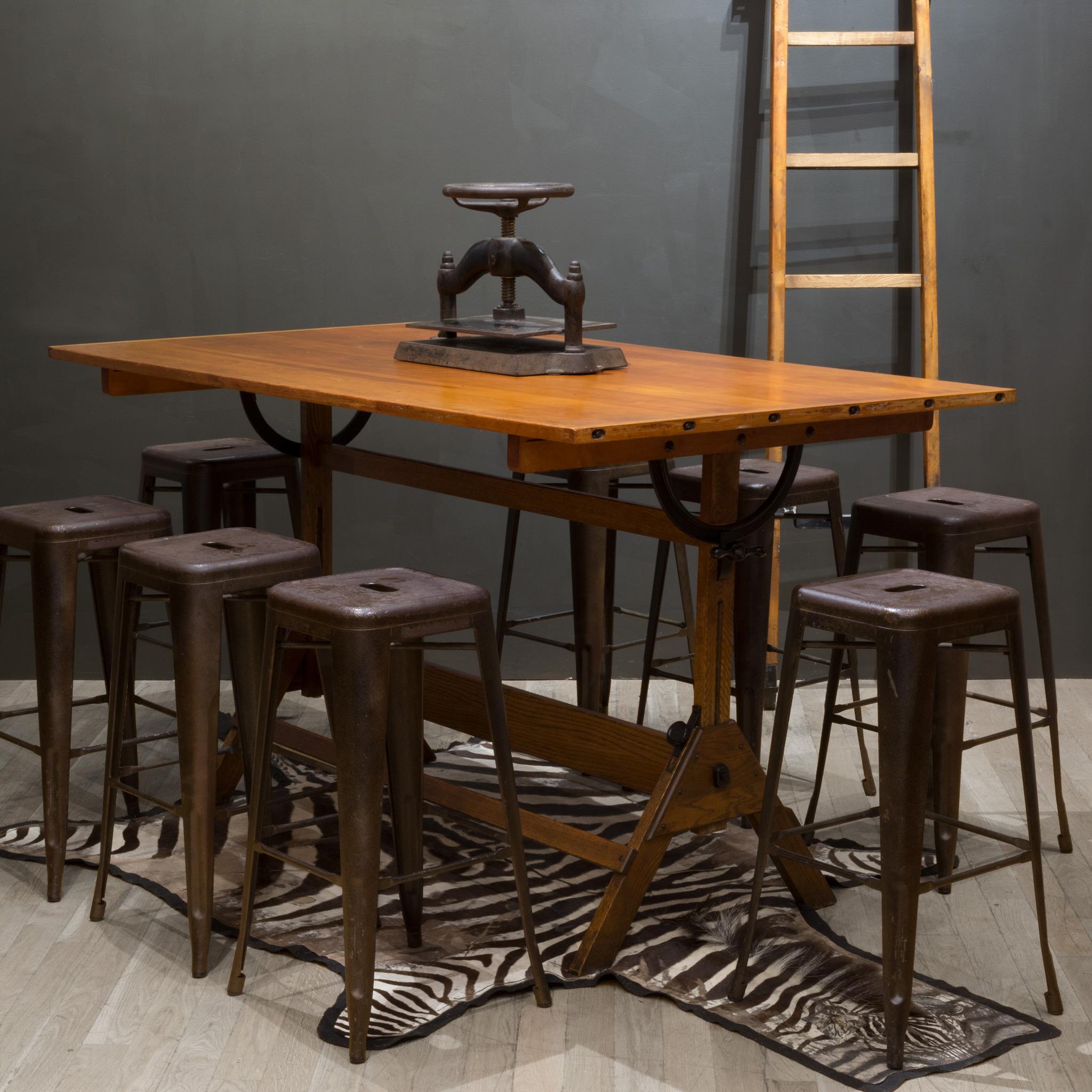 ABOUT

Contact us for more shipping options: S16 Home San Francisco. 

A large fully adjustable industrial drafting table with solid wood top and cast iron knobs. The table can be used as a tall dining table, desk or drafting table. The top swivels