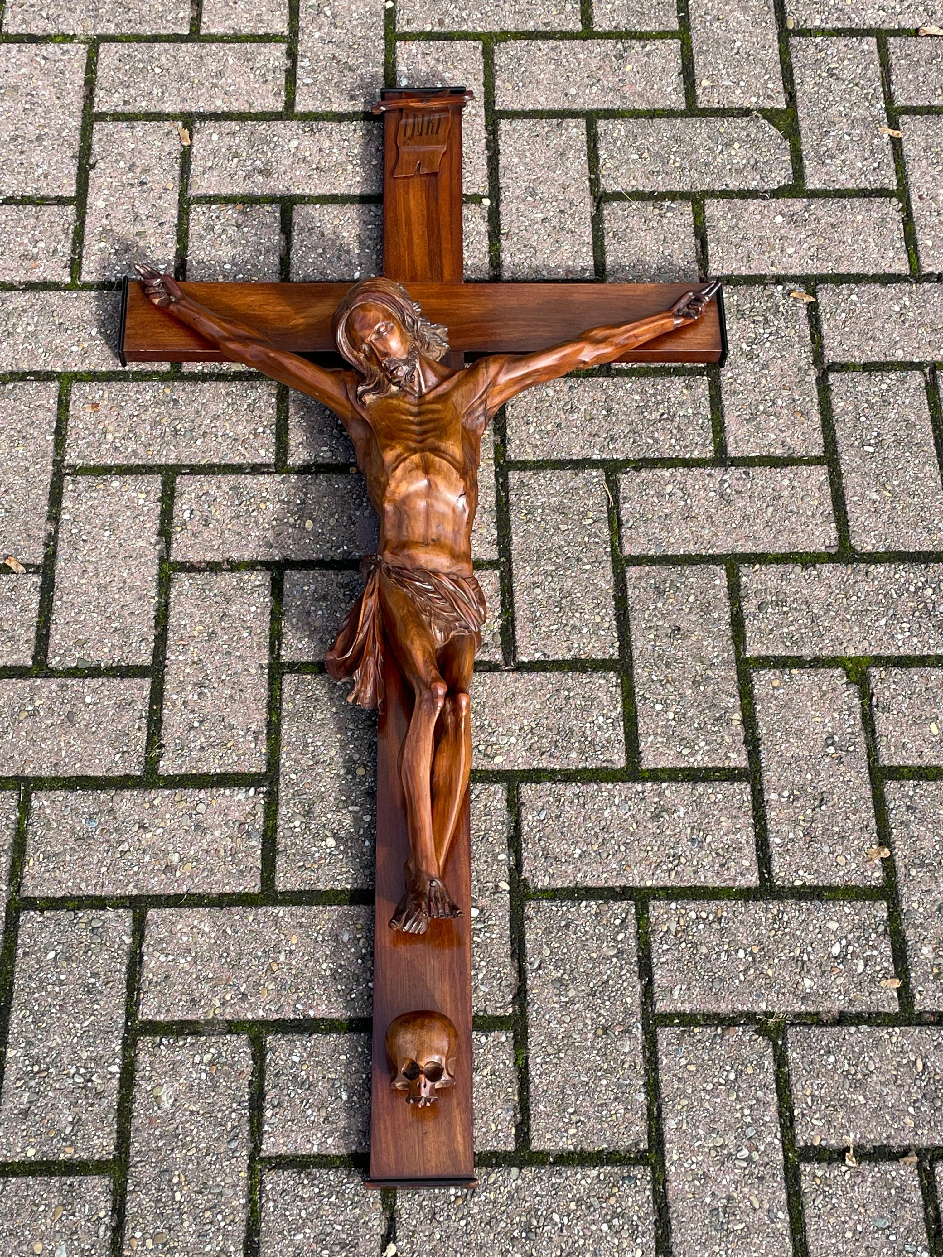 Perfectly hand carved corpus with a great patina.

Over the decades we have sold a number of unique and interesting crucifixes, but we had not yet come across an antique crucifix with a corpus of Christ with both hands showing the two finger symbol.