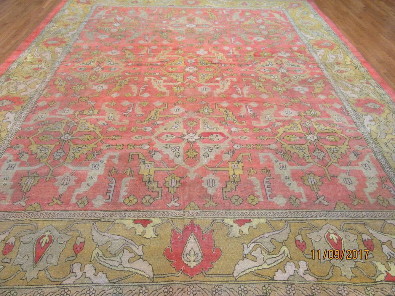 This is a beautiful late 19th century antique hand-knotted Indian Agra rug. It has an elegant all-over pattern perfect for any room. The rug measures 11' 3'' x 13' and made with wool and cotton.