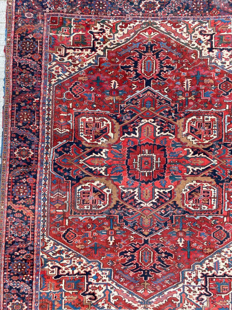Beautiful early 20th century large rug with a nice geometrical and decorative design and beautiful colors with red, blue, yellow and orange, entirely hand knotted with wool velvet on cotton foundation. Size: 9ft 6in x 11ft 5in.