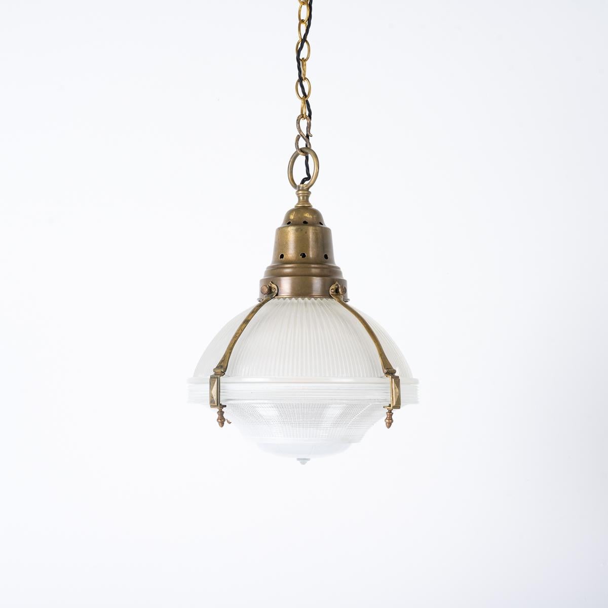 Industriel Large Antique Holophane Brass Caged Three Part Pendant Lights