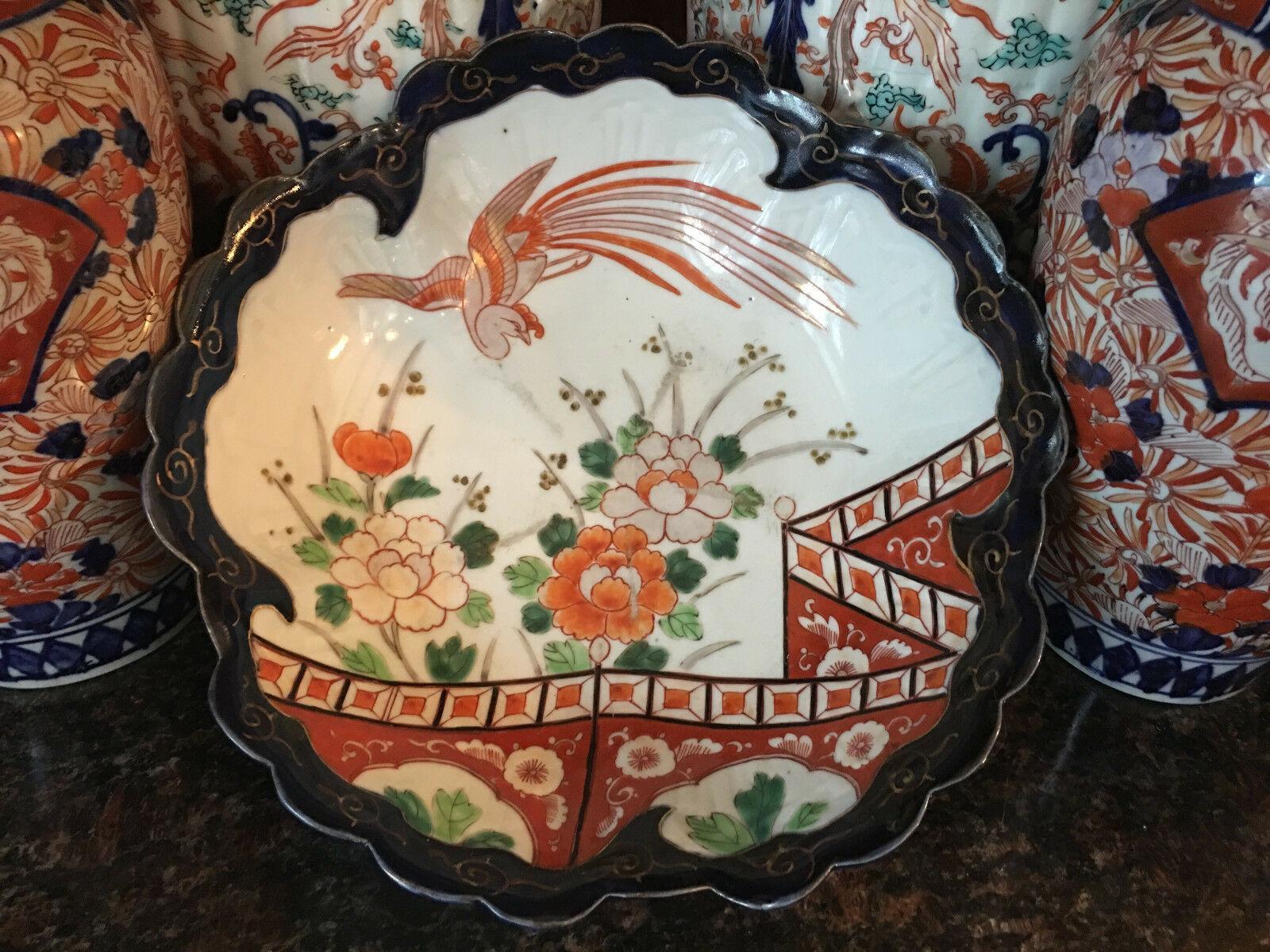 ~Direct from England~
~A beautifully hand painted antique Imari bowl, large size with stunning details!~
~Deep blue painted scalloped edge with gold gilt accents. Large flying bird above the blooming flowers~
~ Traditional red, orange-red and deep