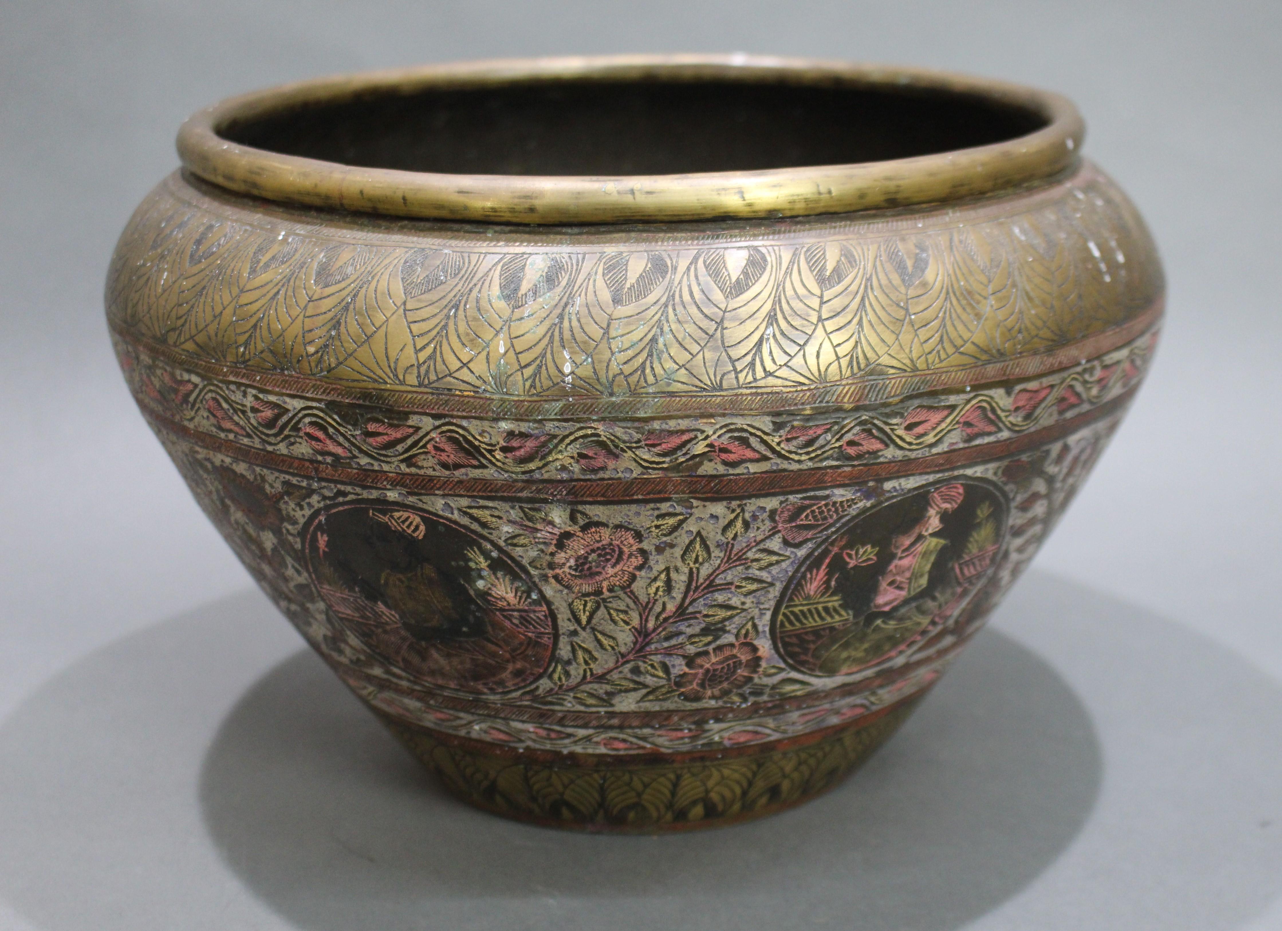 Large Antique Indian brass bowl


19th century. Brass. Indian. 

Beautifully decorated; engraved & enamel. 

Width: 31 cm. 

Height: 20 cm. 

Condition sound; unpolished and wear to decoration commensurate with age.