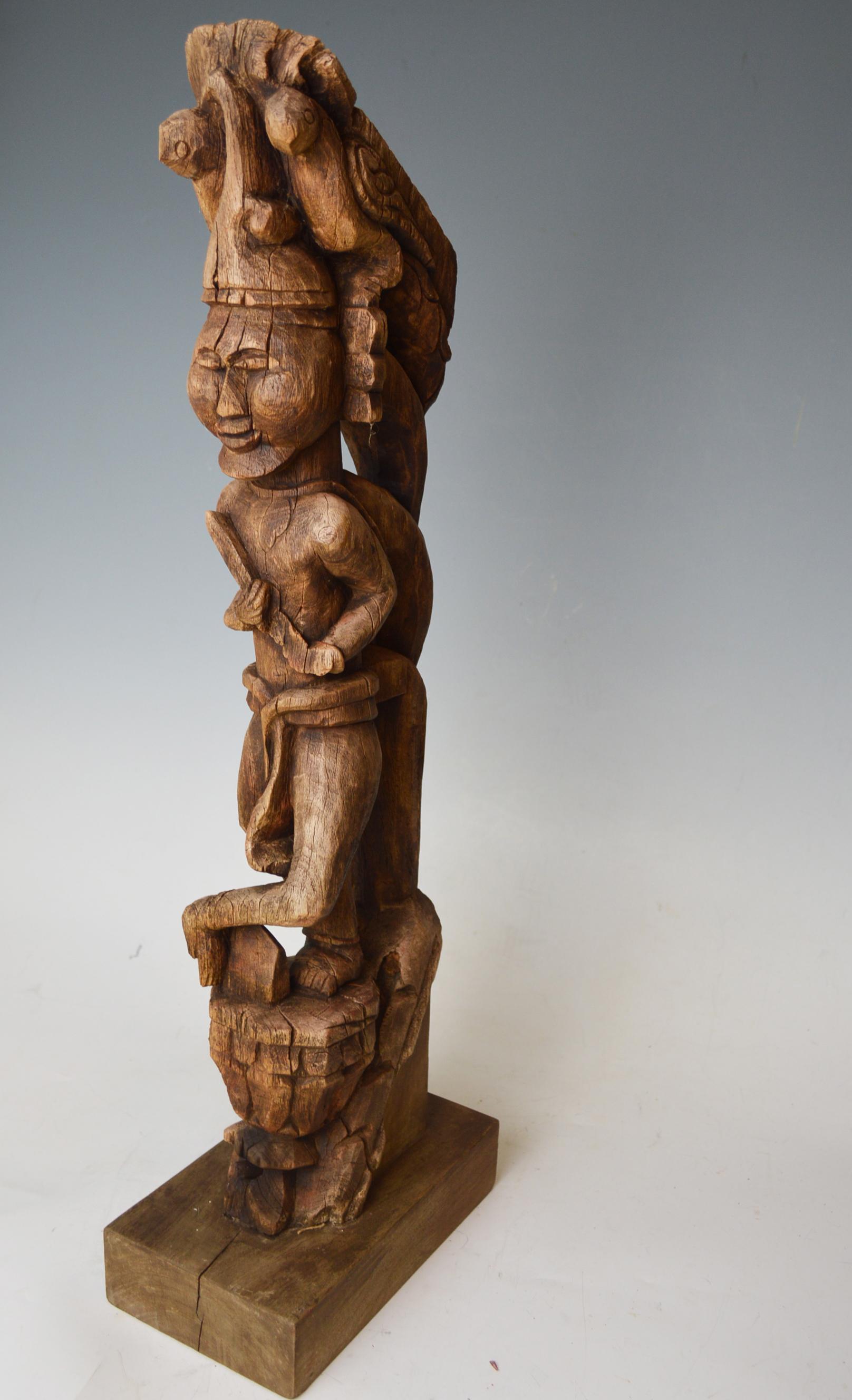 A fine antique indo Burmese bracket figure of standing figure in Longhi
on a traditional shaped pedestal surmounted by birds, probably from a palace
Measures: Height 65 cm, width 10 cm
Presented on a wood stand.
Period: 18th-early 19th century.
