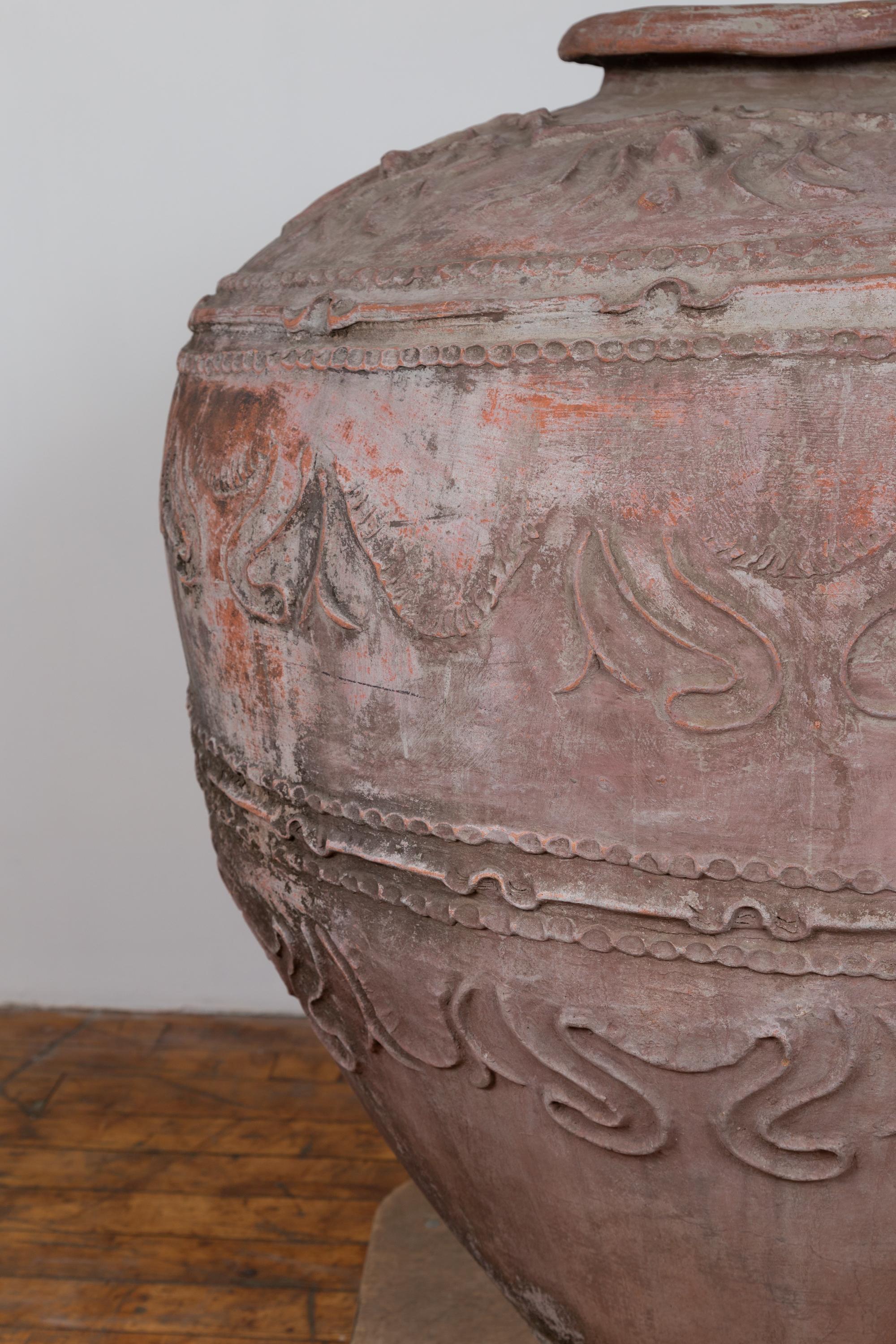 19th Century Large Antique Indonesian Terracotta Water Jar with Wavy Patterns and Aged Patina For Sale