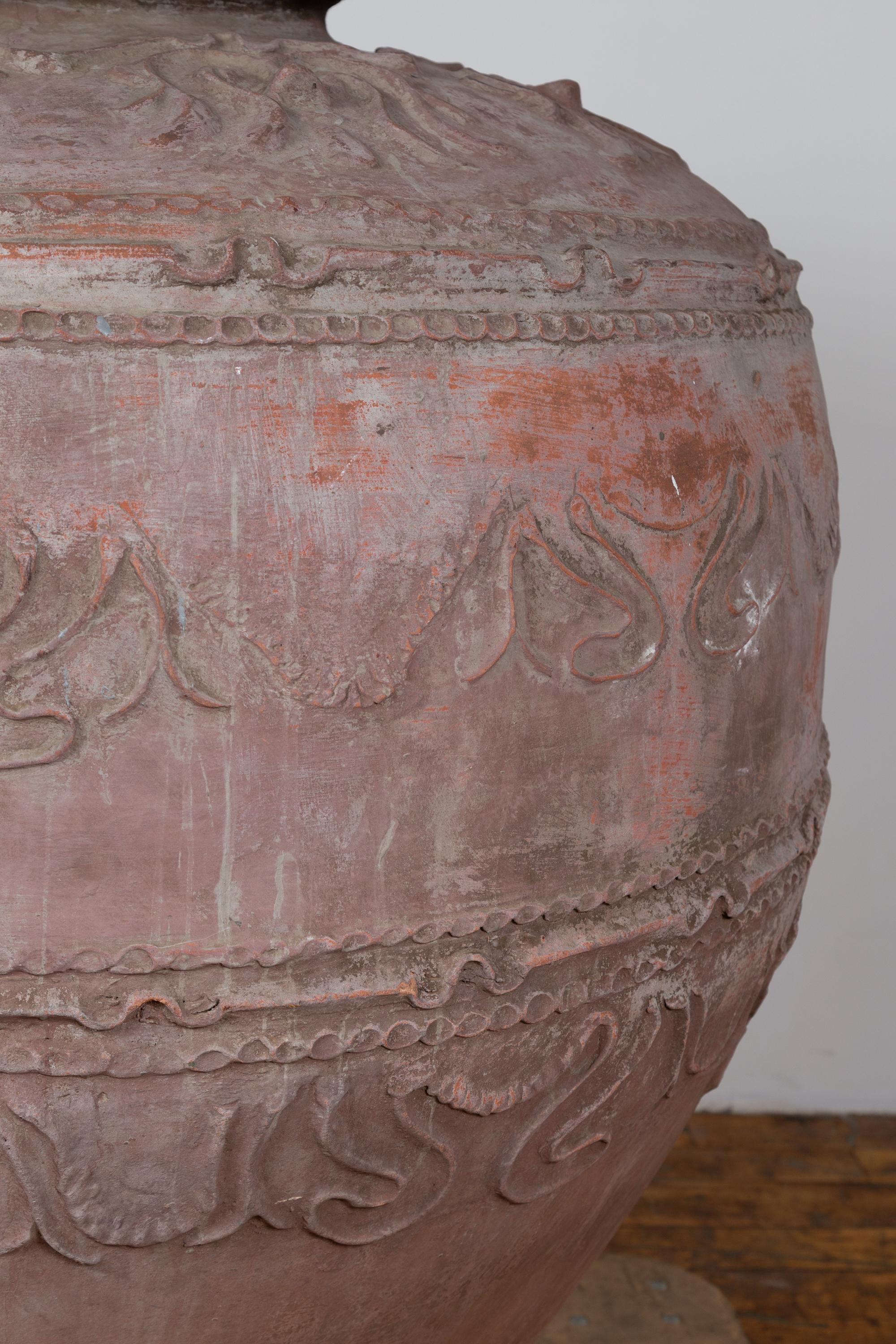 Large Antique Indonesian Terracotta Water Jar with Wavy Patterns and Aged Patina For Sale 1