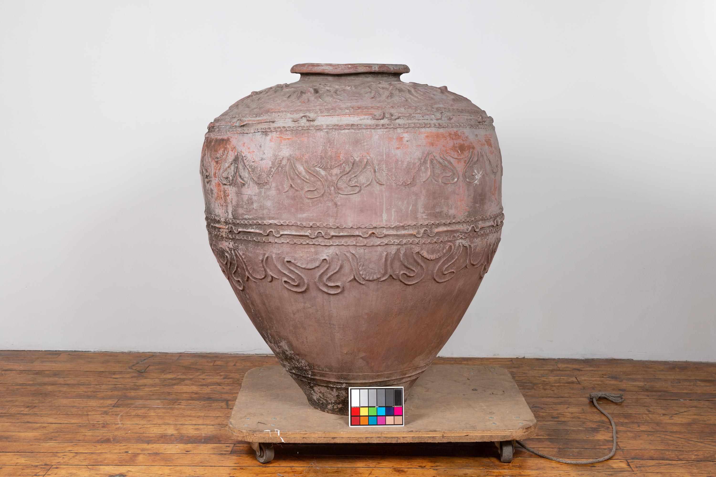 Large Antique Indonesian Terracotta Water Jar with Wavy Patterns and Aged Patina For Sale 2