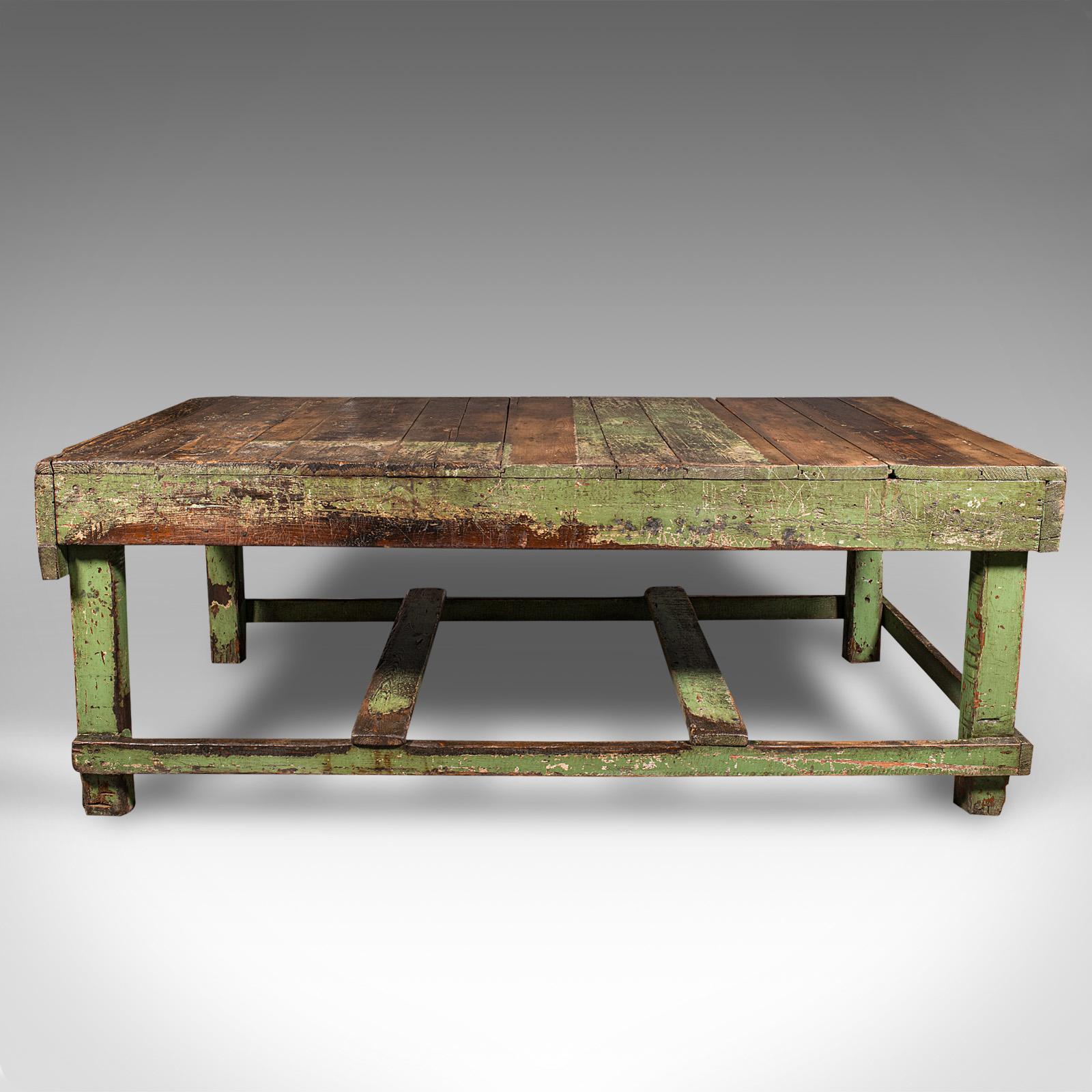 
This is a large antique industrial work table. An English, pine original factory bench to seat 6, dating to the late Victorian period, circa 1900.

Blessed with a wonderful timeworn character and distinctive appeal
Displaying a desirable aged