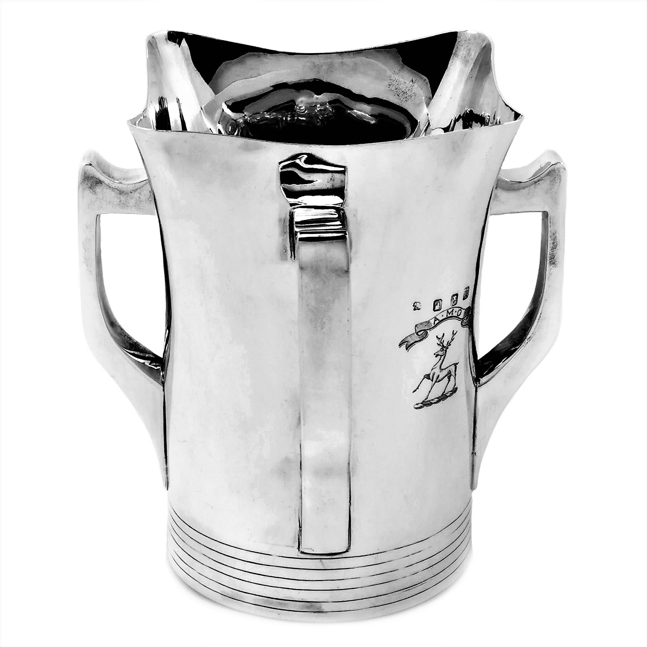 An impressive Antique Irish Silver Vase or cooler in the shape of a traditional Irish silver Mether mead drinking cup. The Mether Cup has a rounded square form with a handle on each side. The Cup has a small crest engraved on the side.
Inspired by