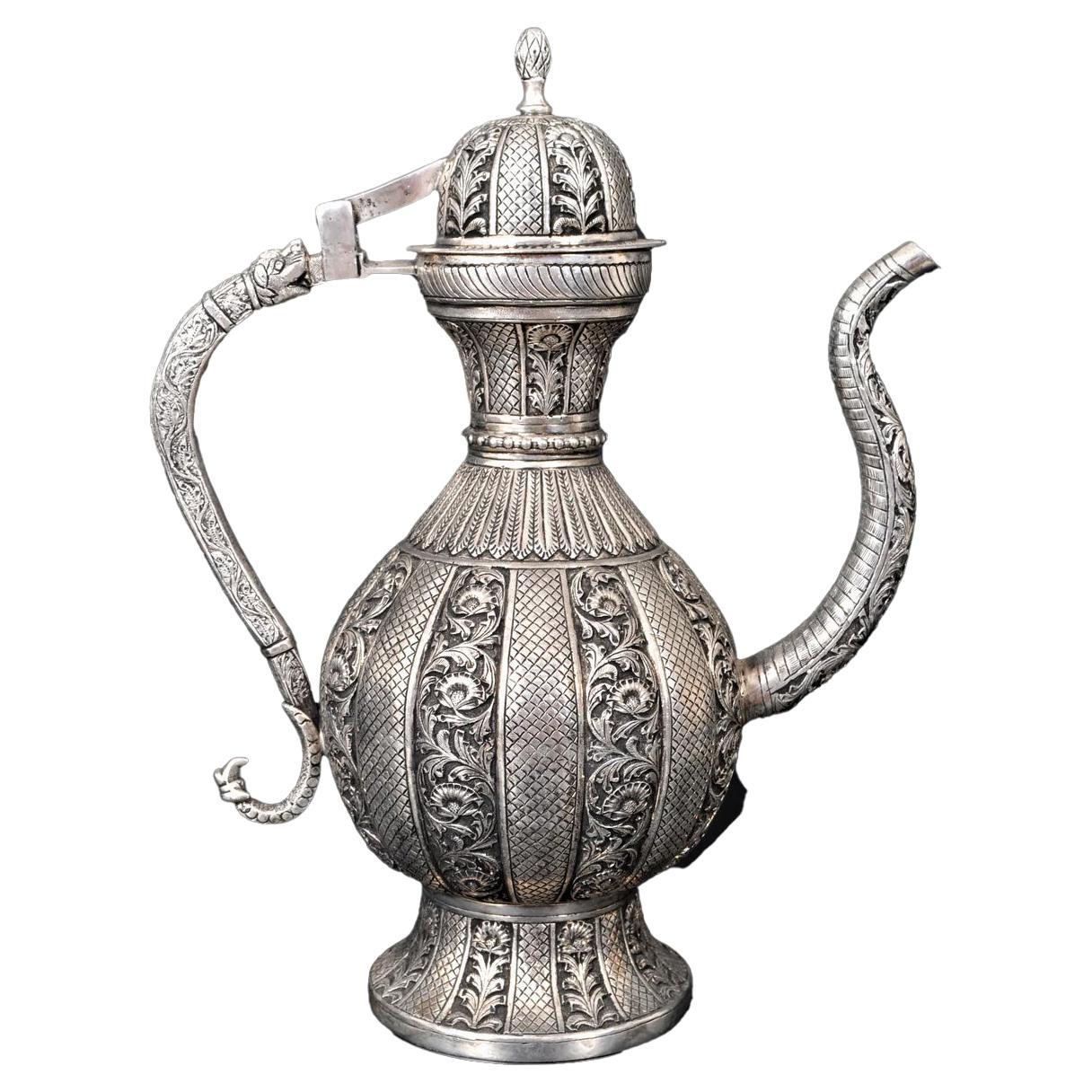 Large Antique Islamic Persian Ottoman Silver Ewer or Pitcher, Qajar Period, circa 1880. 
A large & finely decorated Islamic Persian white metal (silver) ewer dating from the late 19th century, circa 1880 & from the Qajar period. The ewer having a