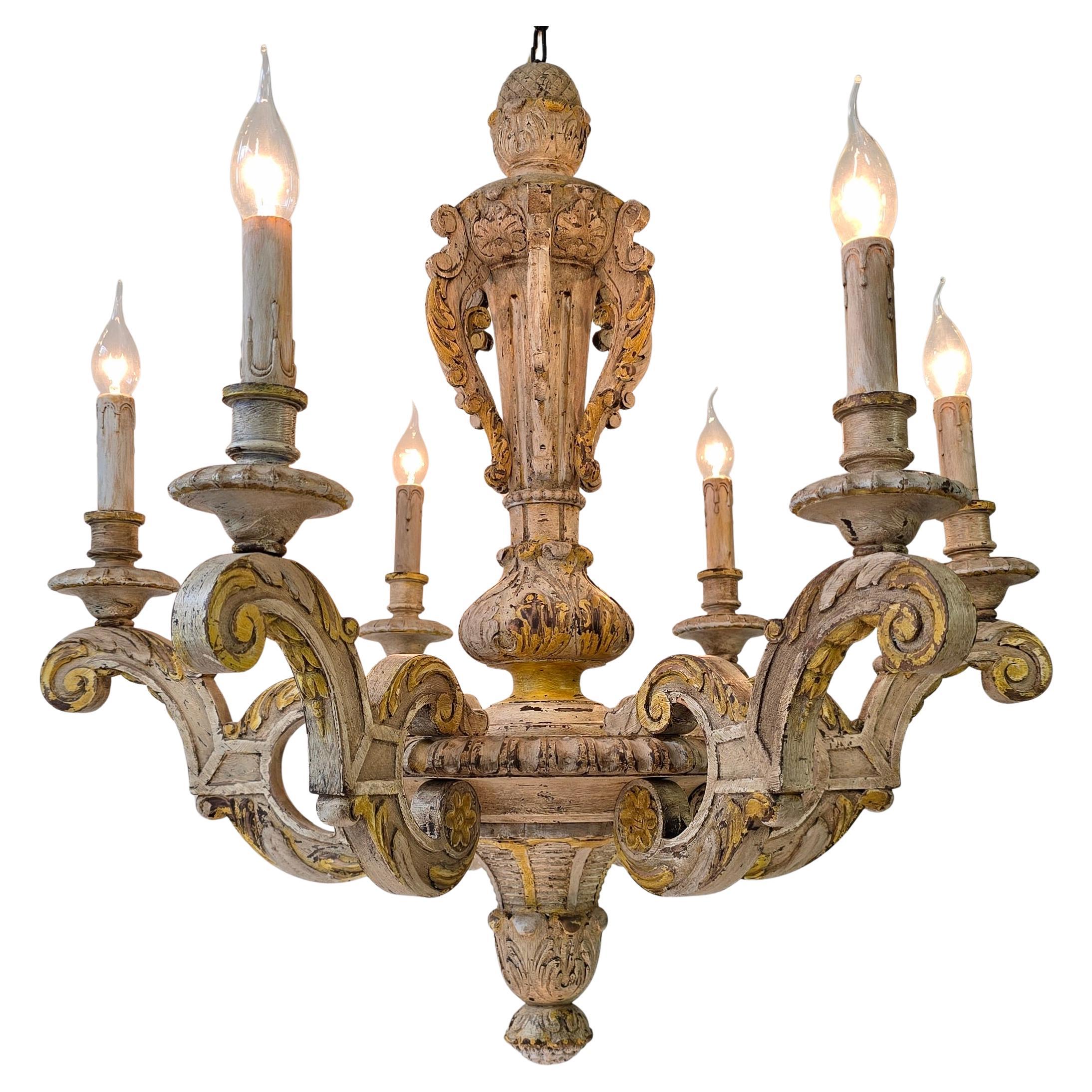 
Large Antique Italian Baroque Chandelier in Carved Wood, Rustic Wabi-Sabi Patina, Original Cream & Yellow Polychrome, c. 1900, 6-Light

Authentic Italian Baroque chandelier (c. 1900) in carved wood with original cream and yellow polychrome. Rustic